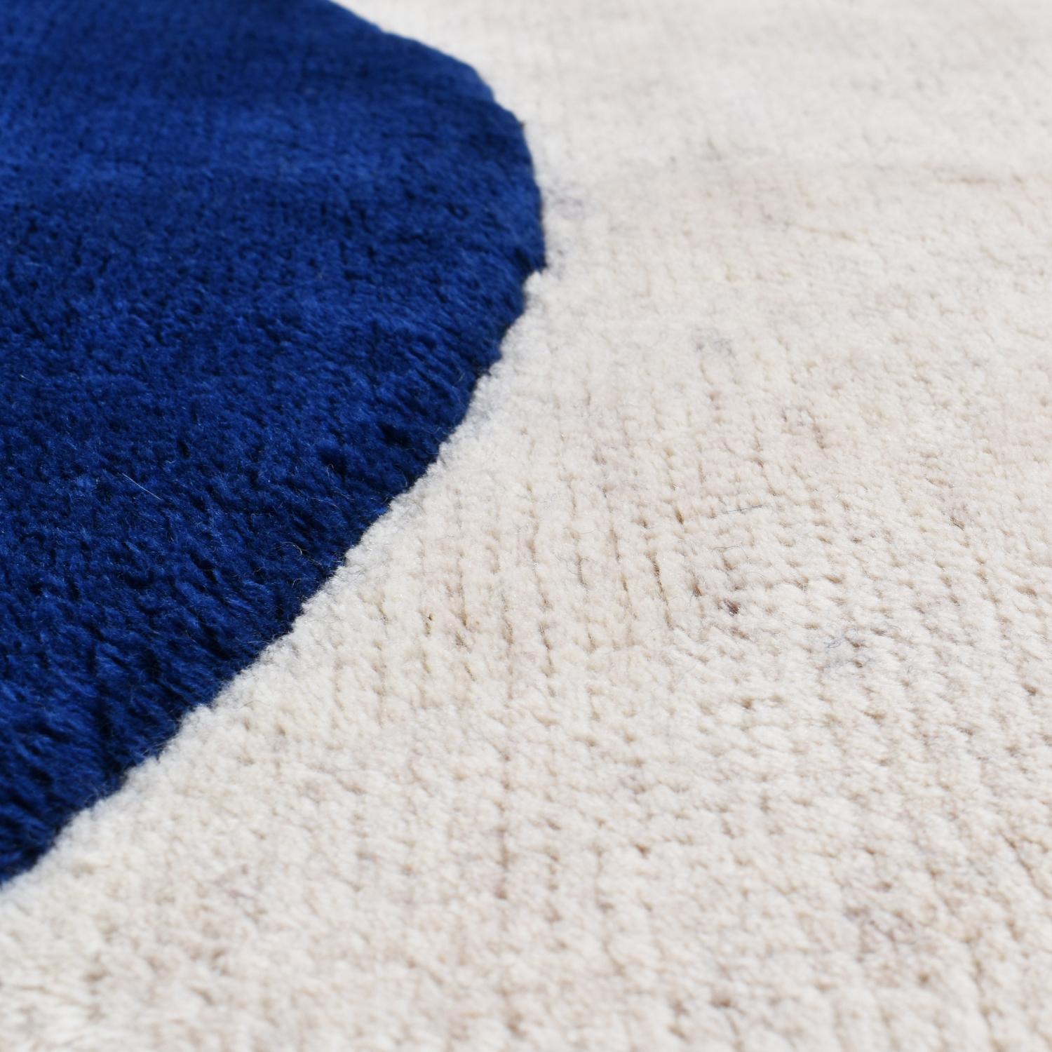 Liquidity, created by Dinodo Studio in collaboration with Nicolas Denino, is a striking piece from the New Life collection, a series of limited-edition art rugs that elevate traditional craftsmanship to a sculptural form. This collection, limited to