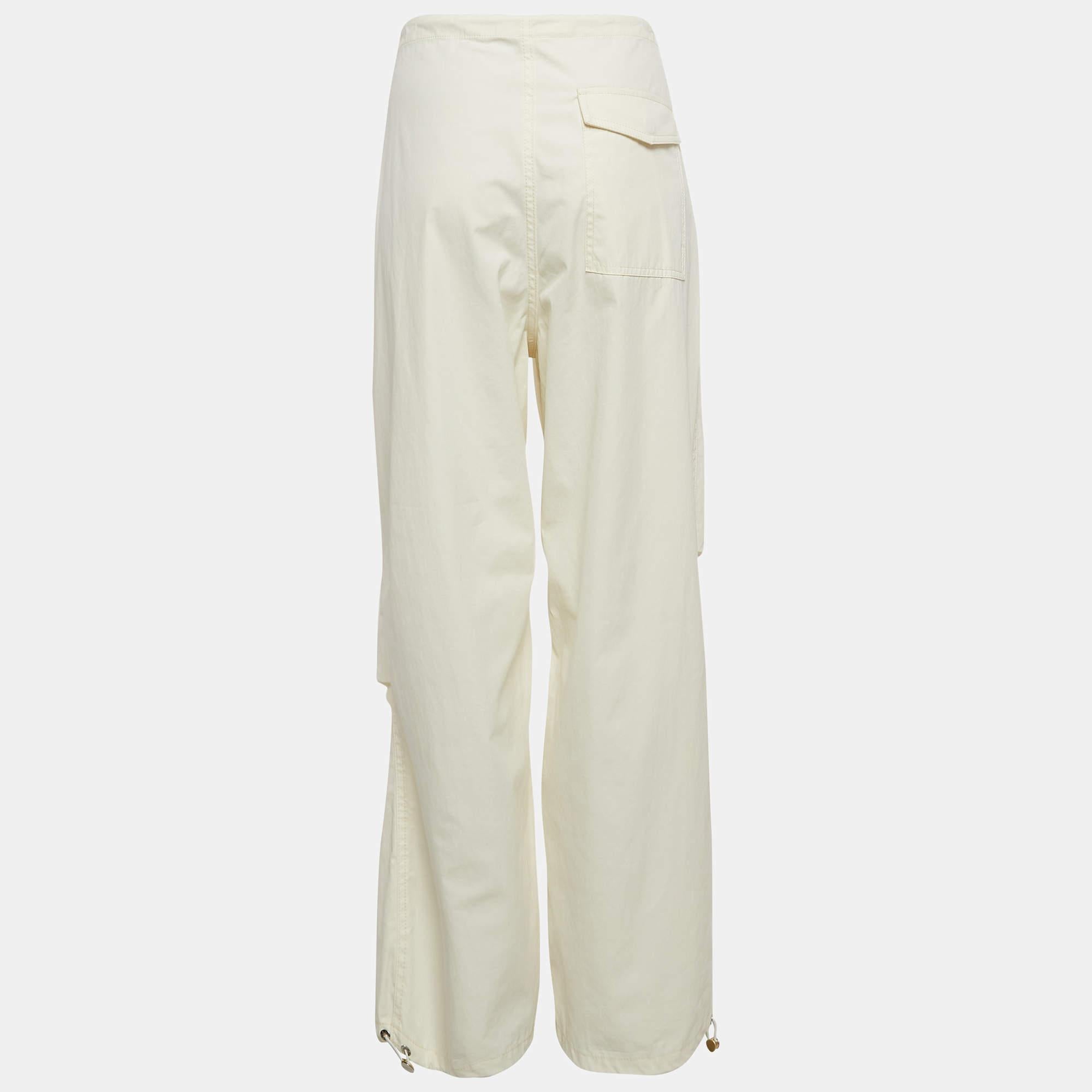 Elevate your style with Dion Lees parachute pants. Crafted from a luxurious cotton blend  these pants feature a relaxed fit with adjustable toggles for a customizable silhouette. The unique parachute design adds an edgy touch  making them perfect