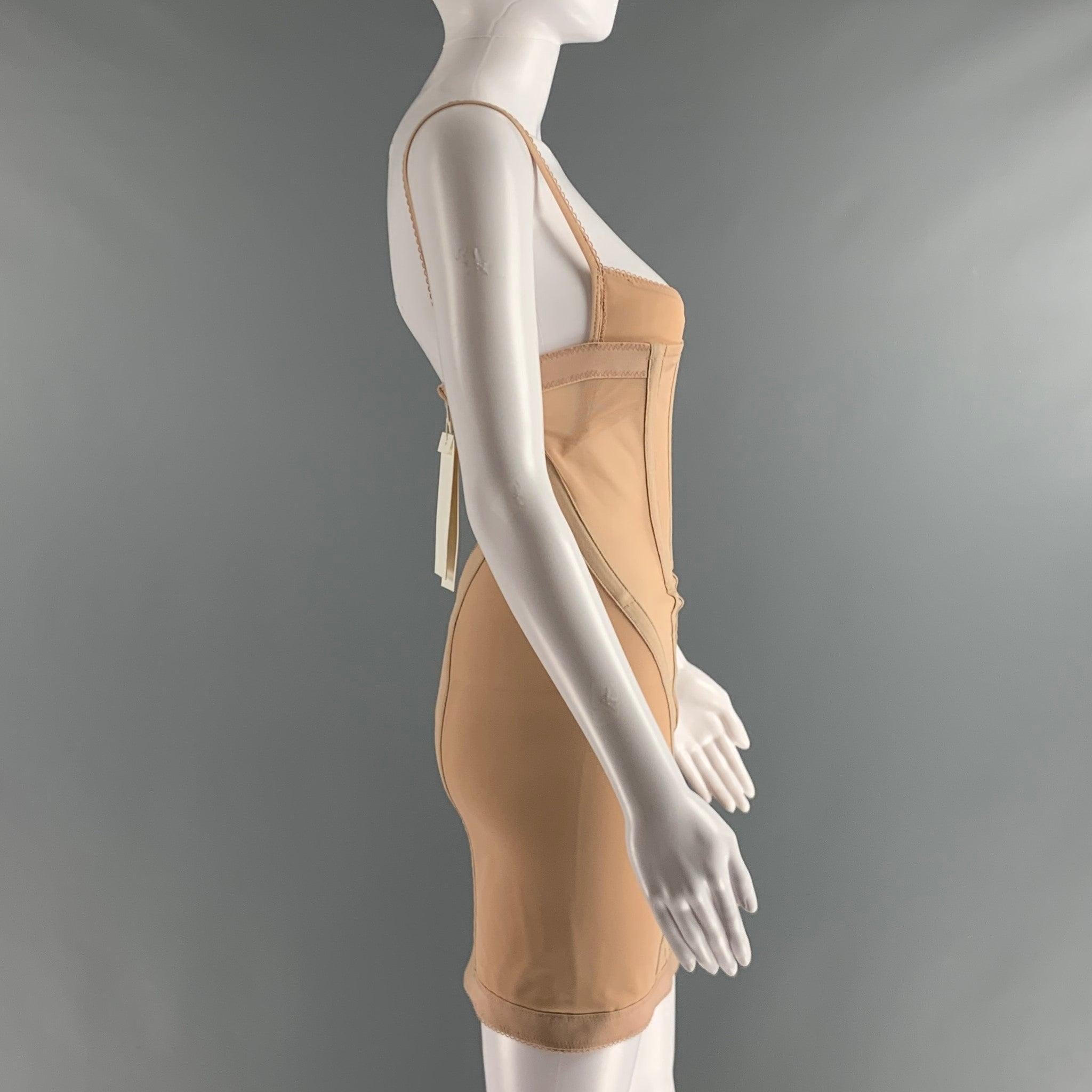 DION LEE mini dress comes in nude polyamide and elastane mesh knit material featuring corset dress design, back zip up closure, and spaghetti strap.New with Tags. 

Marked:   6 

Measurements: 
  Bust: 27 inWaist: 24 inHip: 30 inLength: 23.5 in
 
 