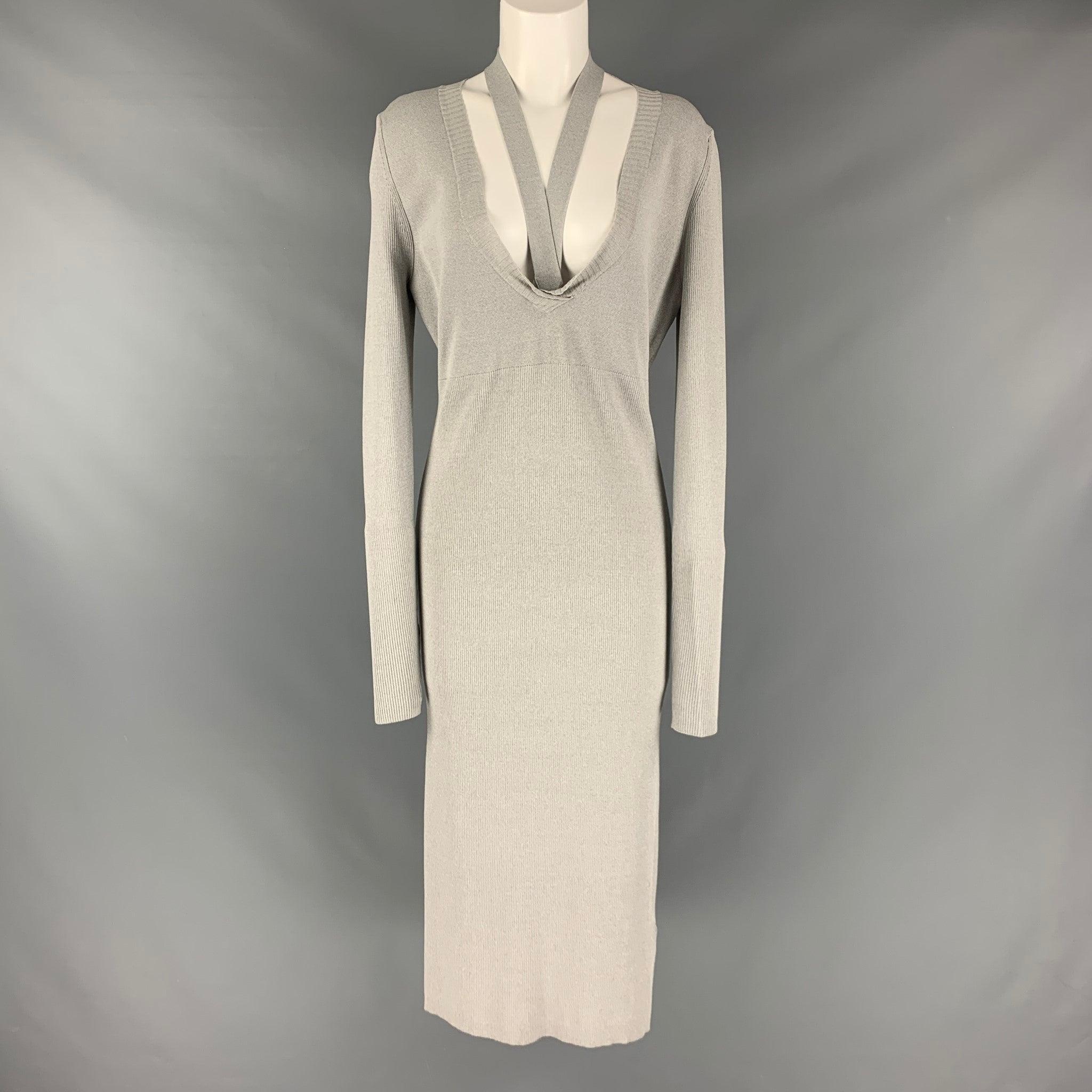 DION LEE dress in a grey viscose blend knit material featuring a v-neck, stretchy form-fitting look, ribbed texture, and mid-calf length.Very Good Pre-Owned Condition. Minor signs of wear. 

Marked:  8 

Measurements: 
 
Shoulder: 16.5 inches