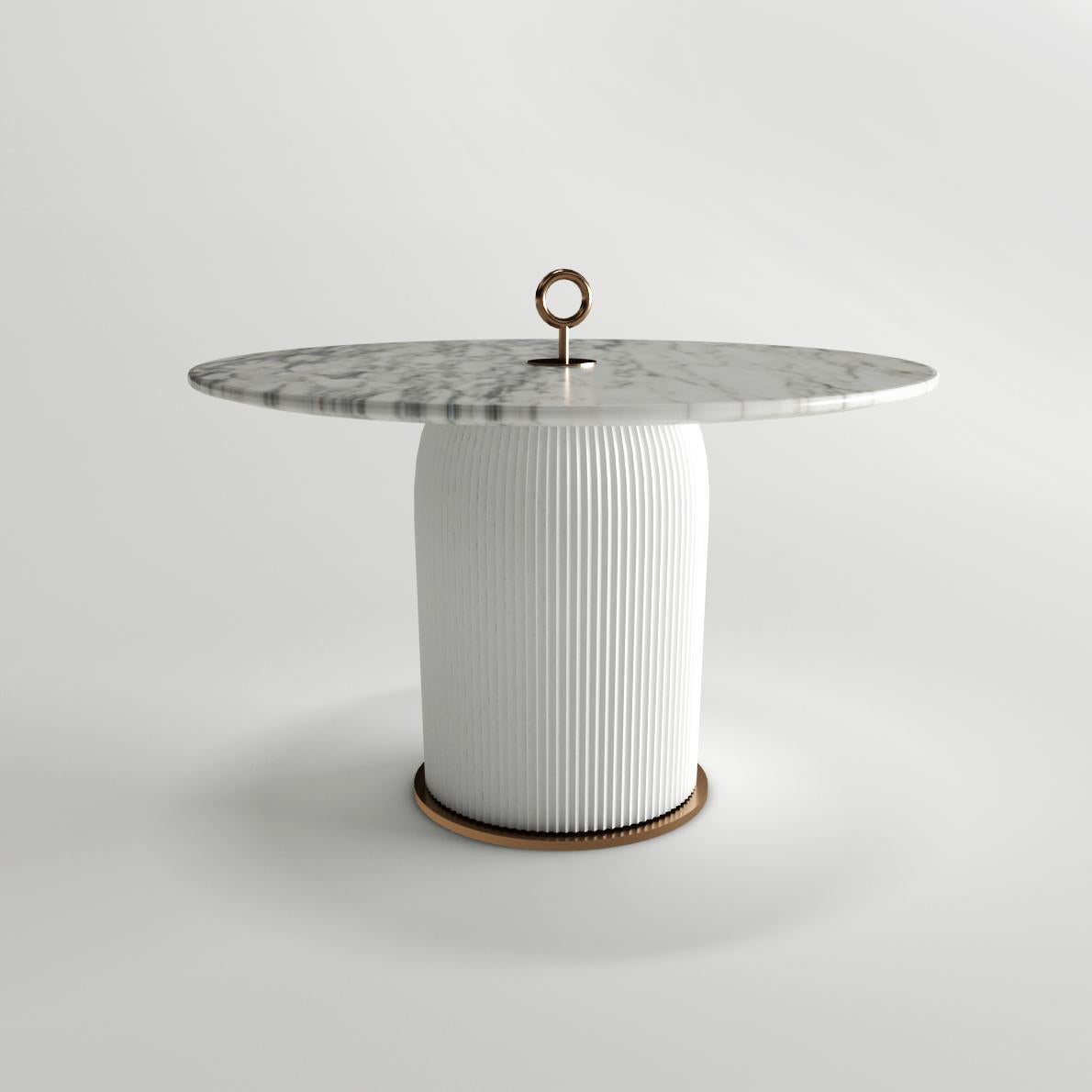 Sculptural coffee tables that combine, in different shapes, noble materials as marble, metal galvanic finish and handcrafted ceramic finely worked by hand in Vietri.