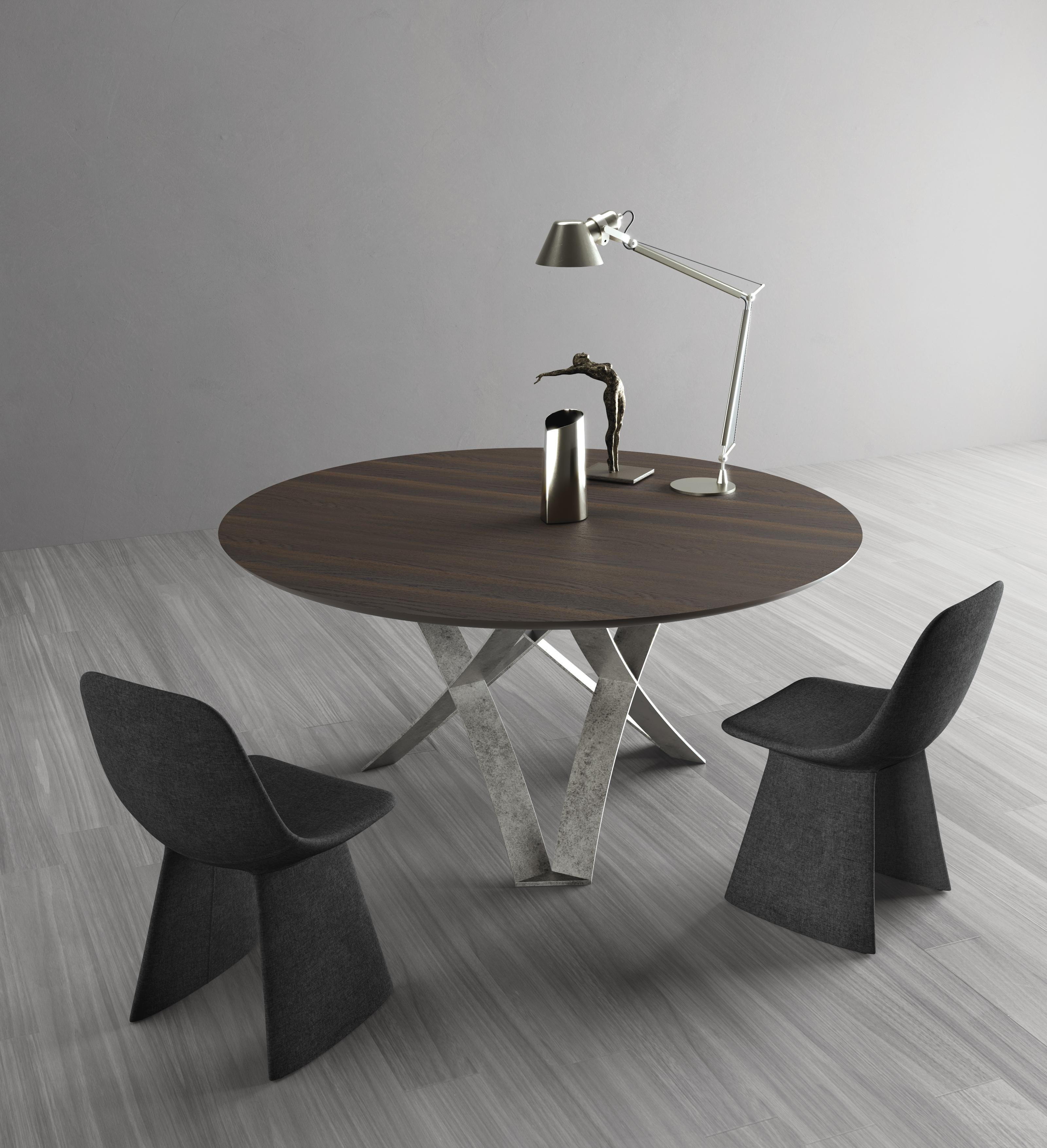 Dioniso Dining Table by Chinellato Design
Dimensions: D 160 x H 73 cm
Materials:
Top: thermally treated oak top.
Base: Black patinated silver-finished.

Round dining table available in two sizes, offered with three combinations of base and Top