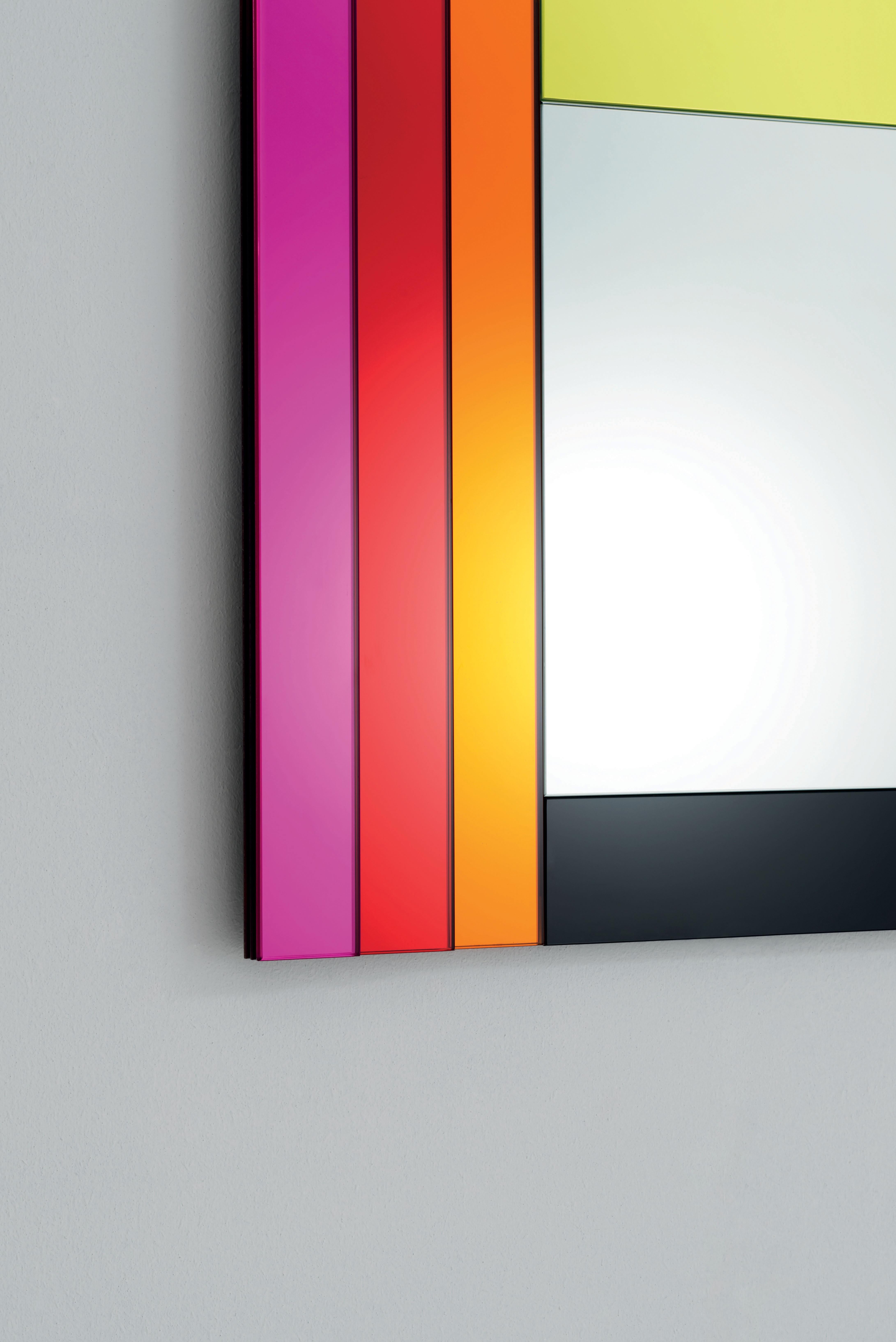 Dioniso3 Gli Specchi di Dioniso wall mirror is from a collection of 6 wall mirrors in different shapes and sizes characterizes by polychromatic frames composed of elements in laminated coloured mirror, coloured laminated glass and lacquered