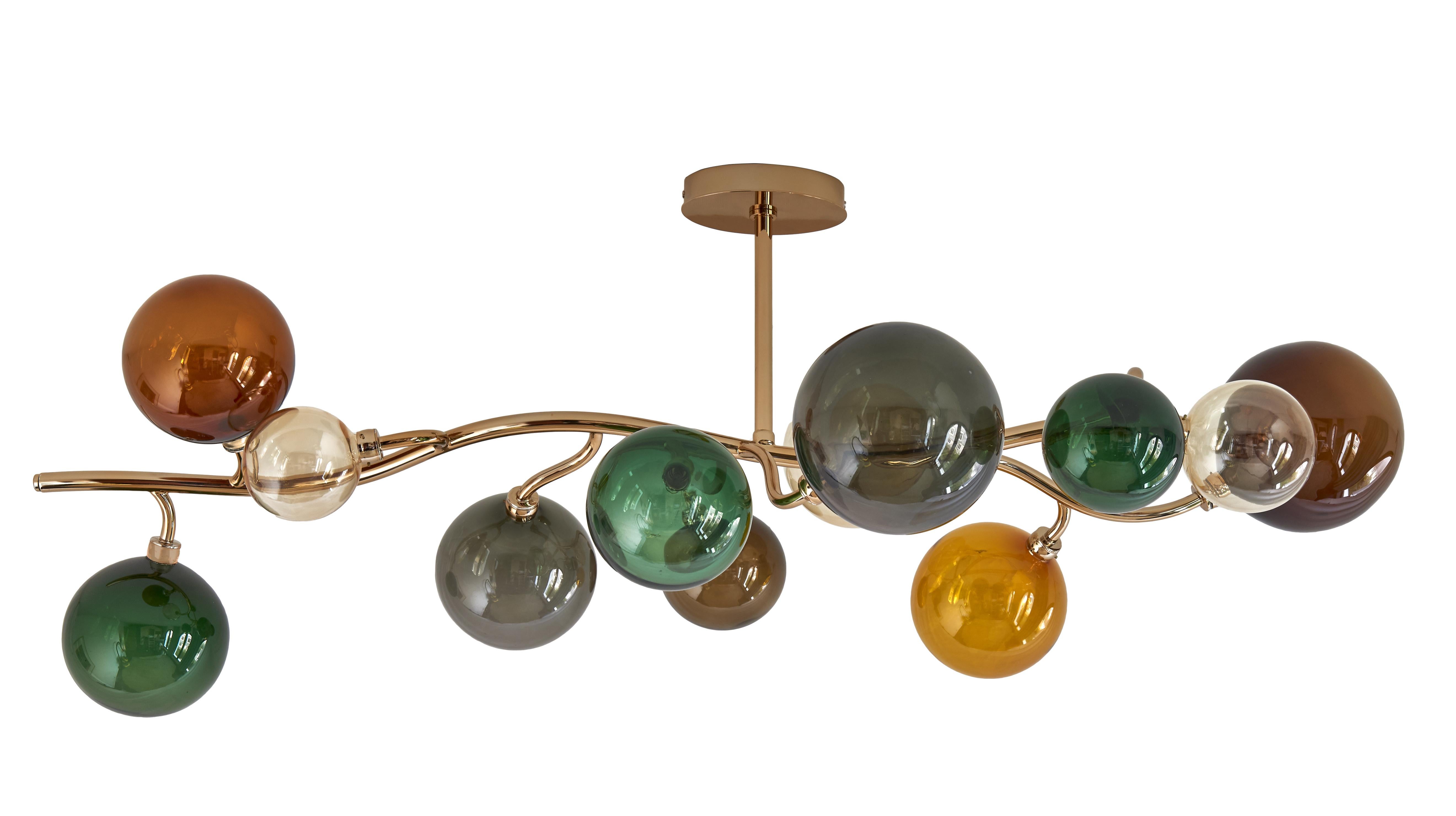 Dionysos Chandelier by Emilie Lemardeley
Handmade in France, 21st century
Metal Finish: gold plate on a brass structure. Hand-blown glass spheres. 
Glass colors: smoked grey, dark green, light and dark amber, champagne.

Length: 47.24
