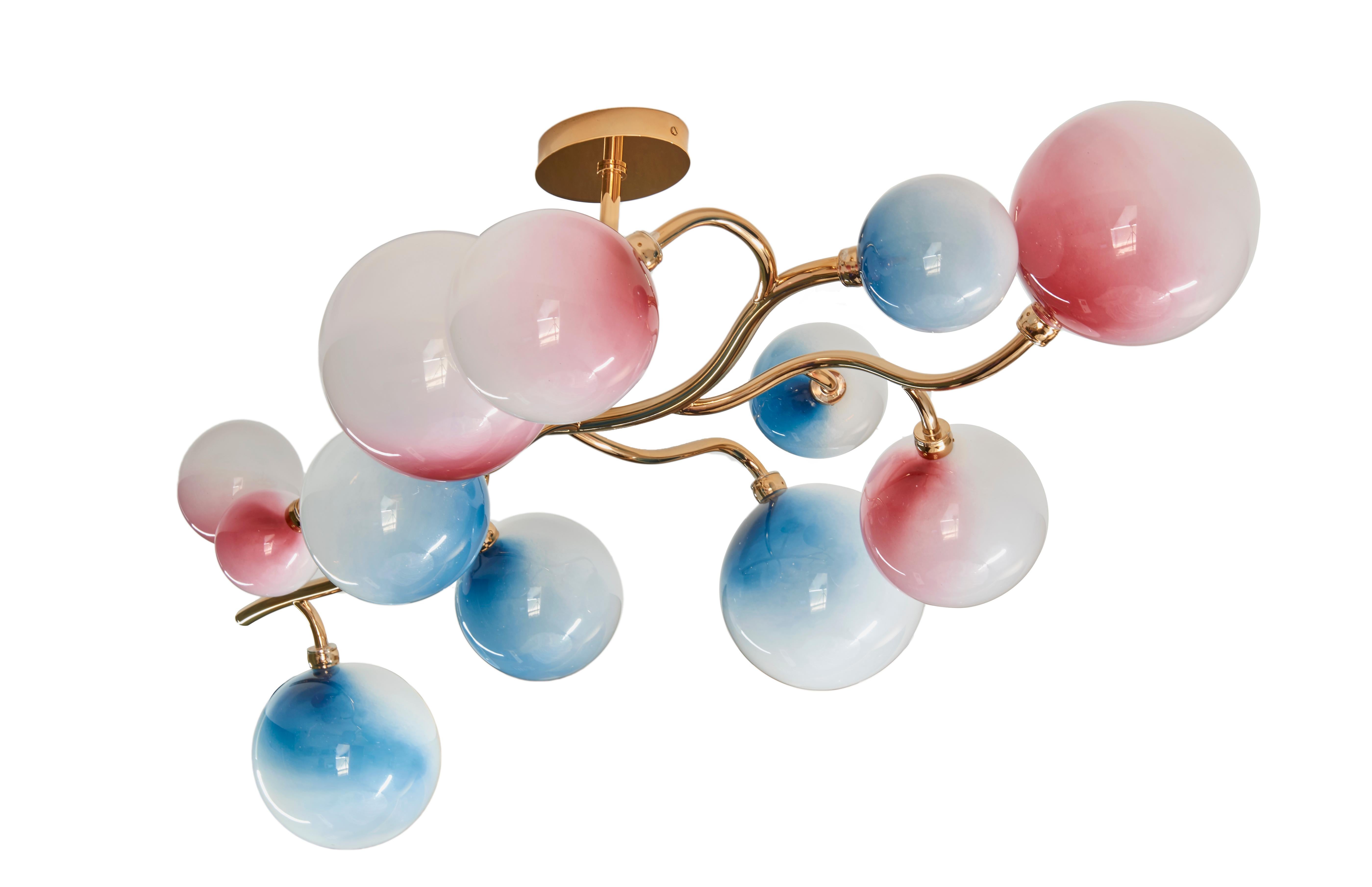 Dionysos chandelier by Emilie Lemardeley, artist.
Polished or brushed brass.
Hand blown glass.
Pink and blue gradation on opalin glass.
Handmade in France, limited edition of 12.

Size: 
width 47.24 inch
height 15.74 inch
deep 23.62