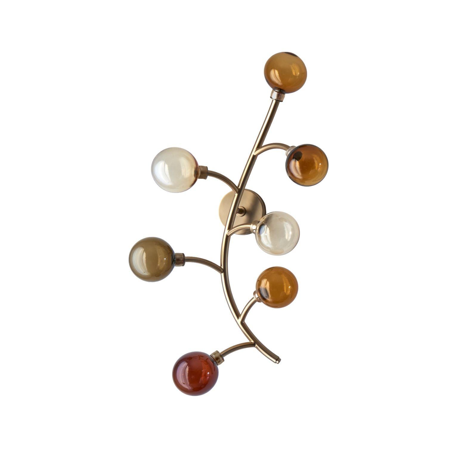Dionysos sconce by Emilie Lemardeley.
Dimensions: D15 x W39 x H70 cm.
Materials: brass and hand blown glass. Led 3W in each glass globe (21W).
Weight: 4 kg

The Dionysos lightings pay hommage to their namesake, the Greek God of Wine. They are
