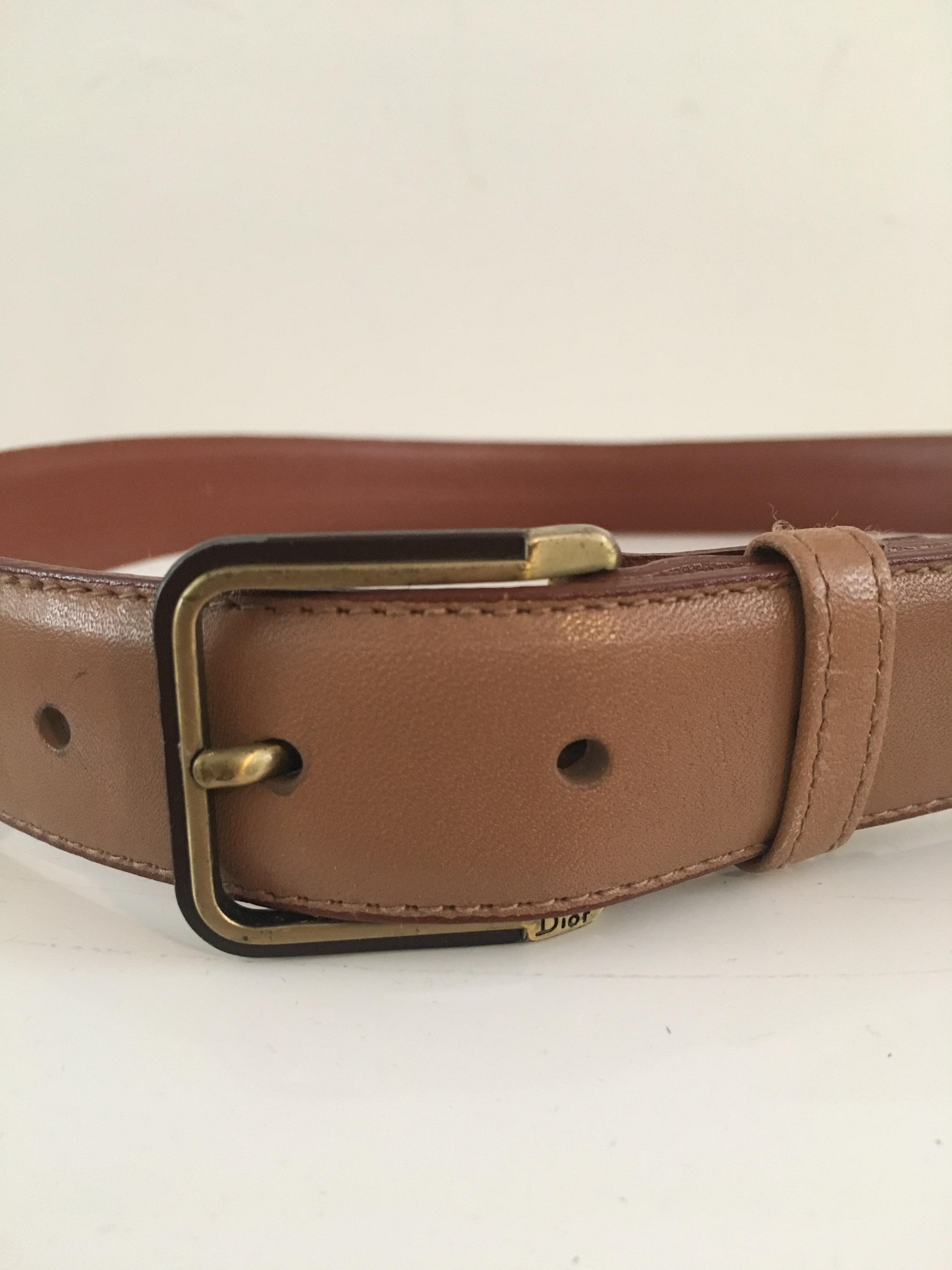 Dior 1990s tan leather belt.  This belt if worn on your waist will fit a size 2, 4, 6.
28. 1/2