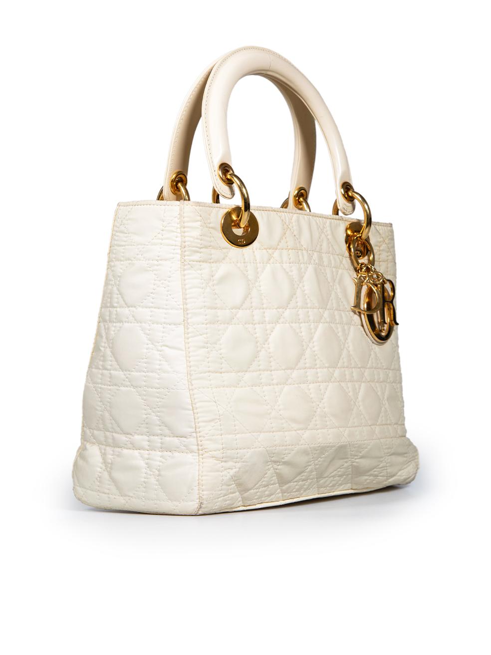 CONDITION is Good. General wear to the bag is evident, there is overall discolouration mainly on the four bottom corners, the top edge of the bag and around the zip area. There is a small mark on the top handle caused from glue residue. The hardware