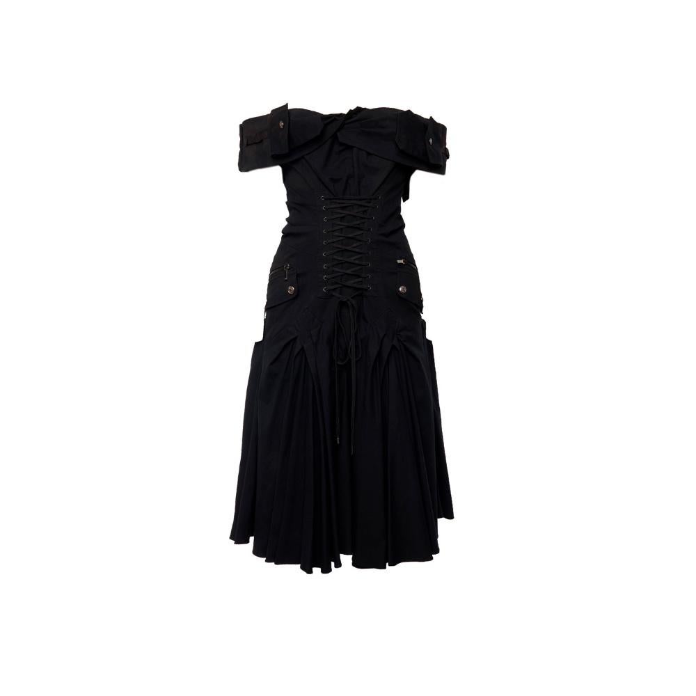 The Dior 2003 Cargo Dress, designed by John Galliano, perfectly blends functionality and high fashion with a distinct avant-garde twist. Made from black cotton, this dress features large pockets and detachable shoulders, adding versatility to a