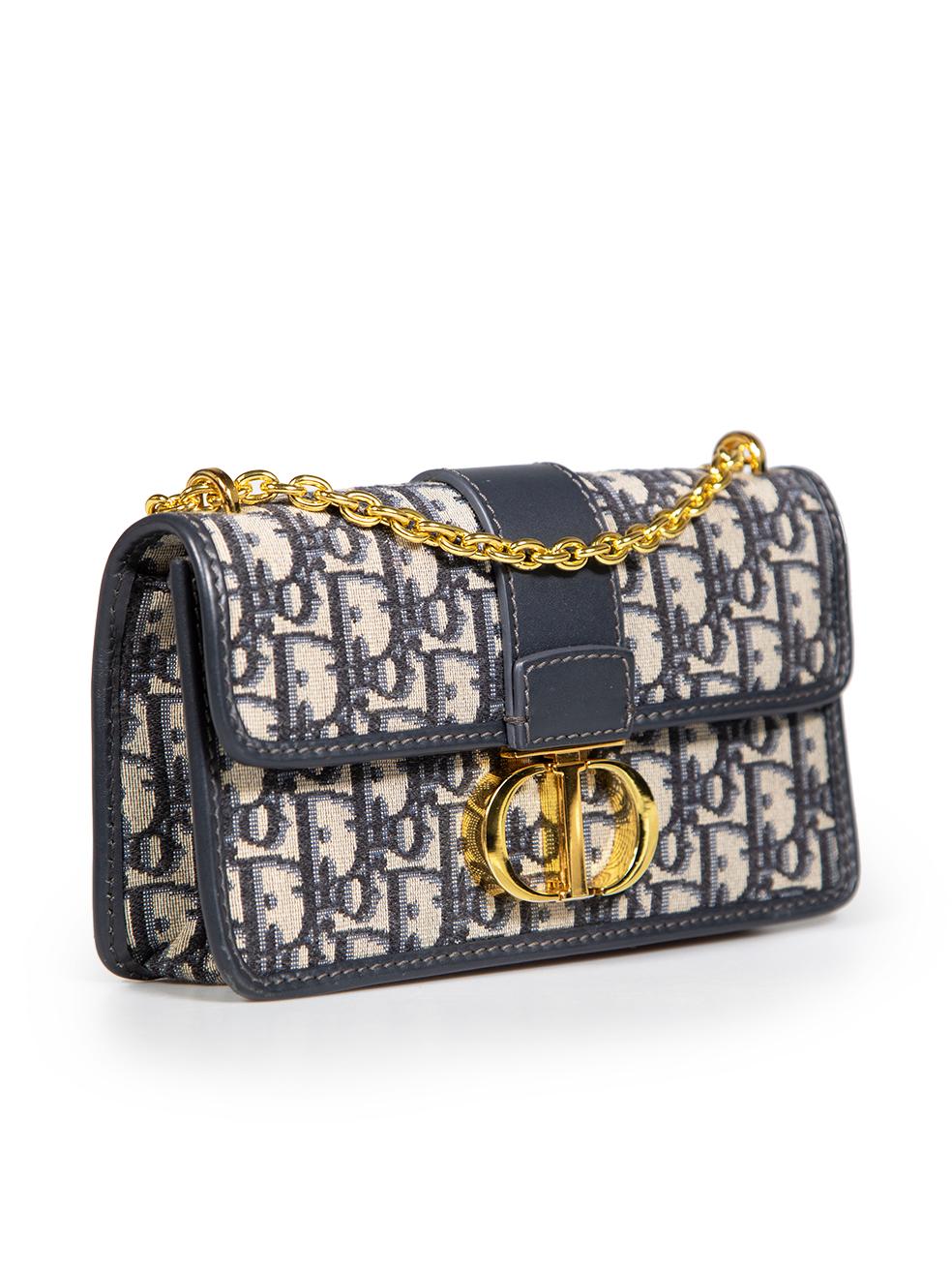 CONDITION is Very good. Minimal wear to bag is evident. Minor scratches to the leather trimming of the bottom corners and the metal hardware of the clasp and shoulder strap of the bag on this used Dior designer resale item.
 Details
 Model: 30