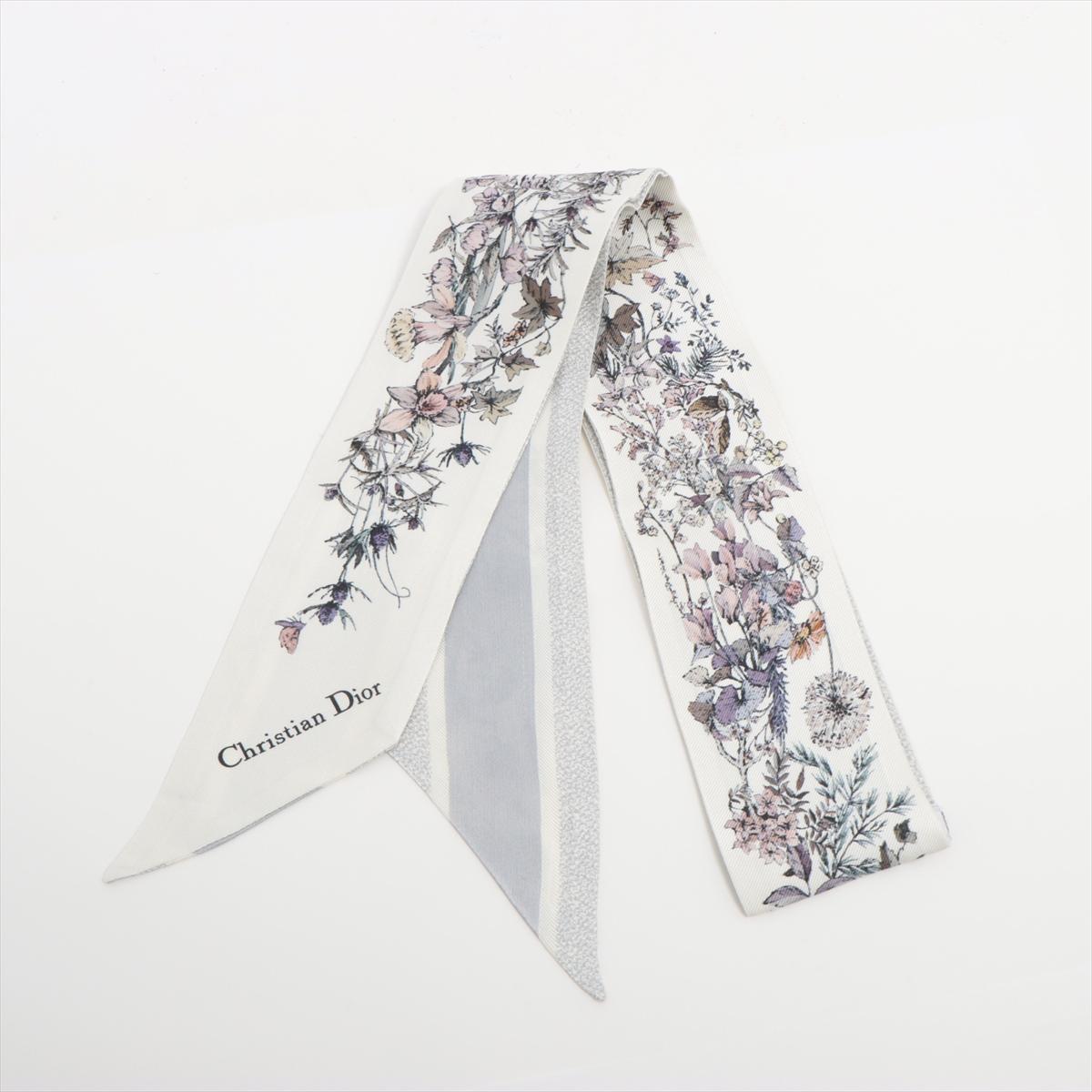 The Dior 4 Saisons Printemps Mitzah Twilly in White Multicolor is a refined and elegant silk accessory inspired by the beauty of spring. Featuring a delicate floral motif in soft pastel hues, the twilly embodies Dior’s timeless sophistication and