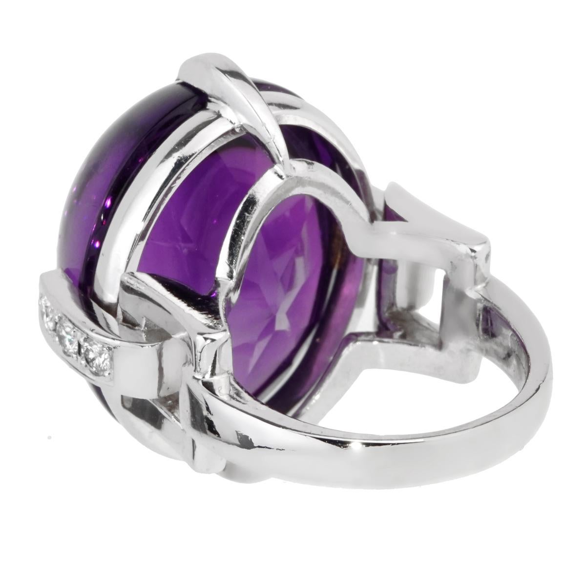 A magnficent Christian Dior diamond ring featuring an oval cabochon amethyst adorned with round brilliant cut diamonds in 18k white gold.