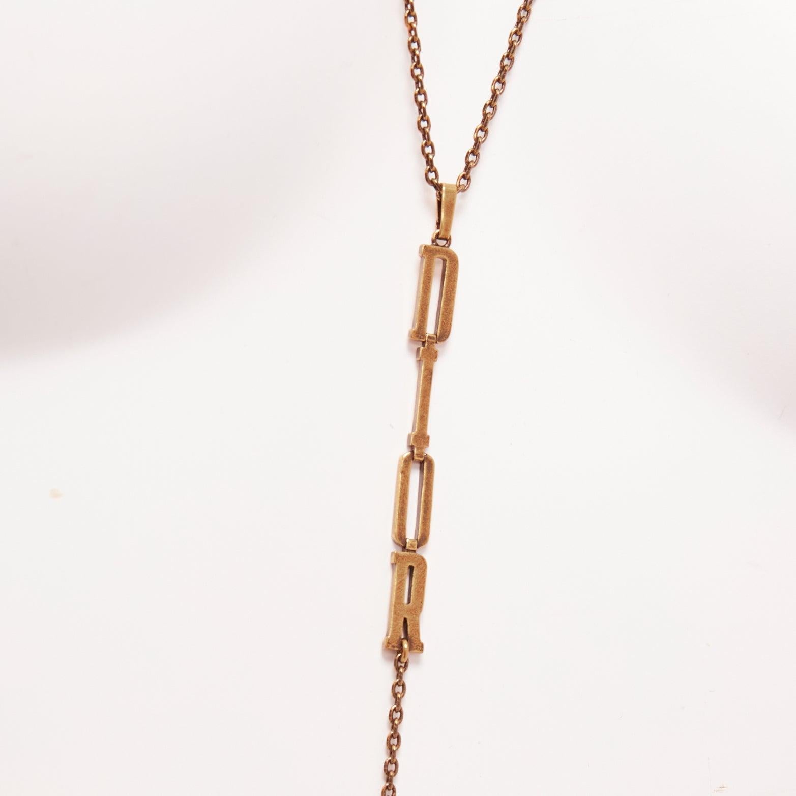 DIOR antique gold vertical logo chain CD star charm tiered necklace
Reference: AAWC/A00917
Brand: Dior
Designer: Maria Grazia Chiuri
Material: Metal
Color: Bronze
Pattern: Solid
Closure: Lobster Clasp
Lining: Bronze Metal
Extra Details: CD and star