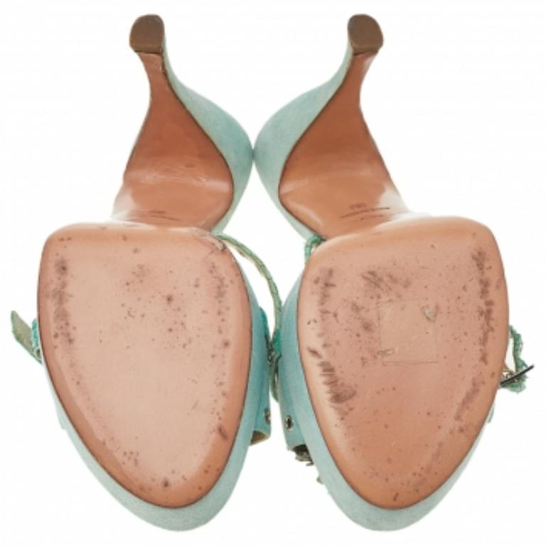 Amp up your style quotient as you glam up your casual outfit with these gorgeous sandals from Dior. These suede shoes will make you look confident and uber-stylish. They come with python-embossed leather trims, platforms, high heels, and eyelet