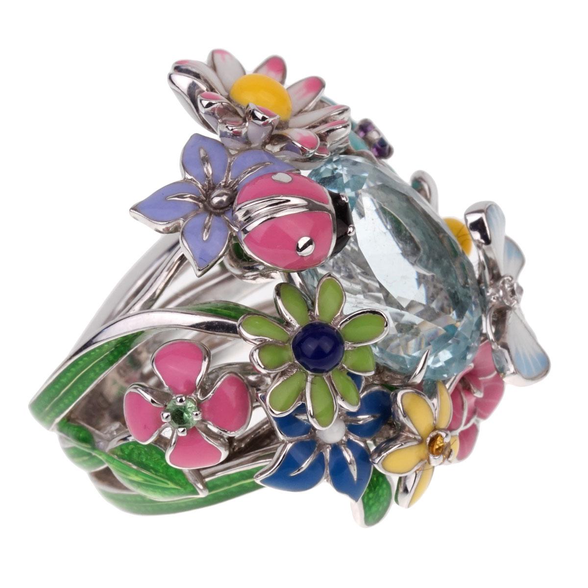 A magnificent Dior ring from the Diorette collection - an ode to the flowers and fantasies of the Christian Dior garden. Crafted in 18k white gold, the ring showcases a large Aquamarine surrounded by Amethyst, Pink sapphire, Yellow sapphire, and