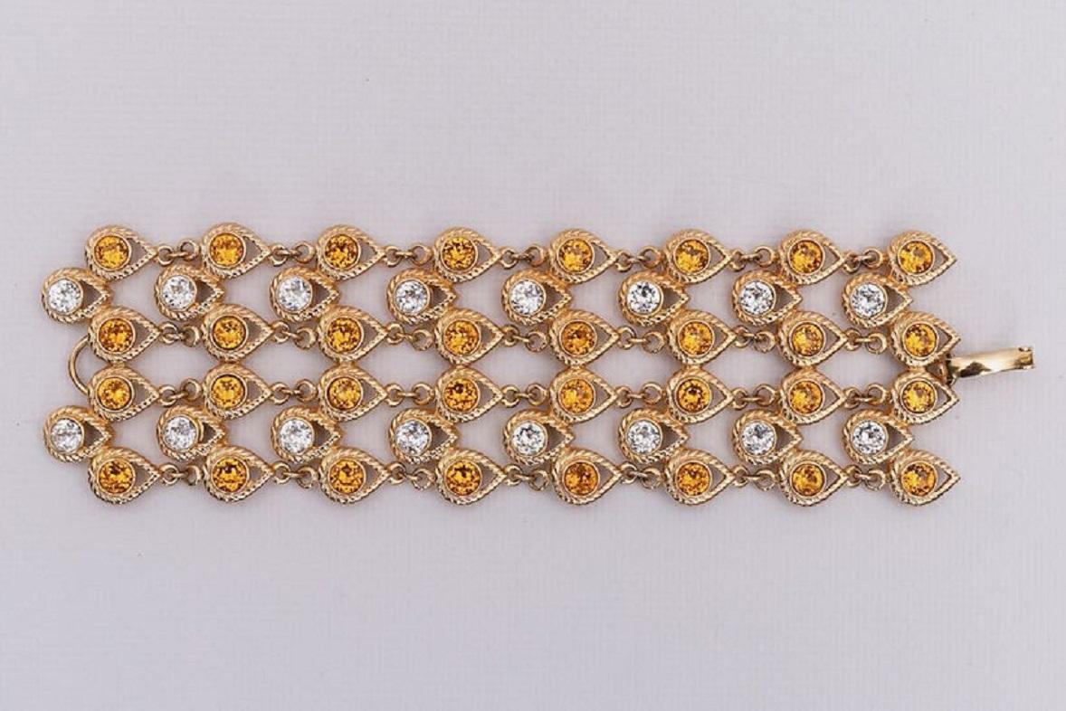 Dior - Articulated bracelet made of gilted metal and paved with rhinestones.

Additional information:
Dimensions: Length: 18 cm (7.09 in) 
Width: 5 cm (1.97 in)
Condition: Very good condition
Seller Ref number: BRA64