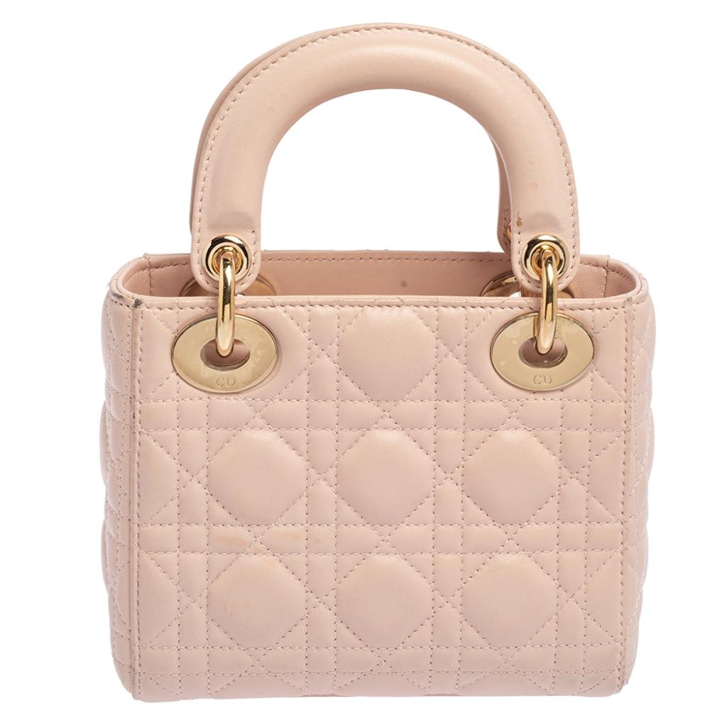 The Mini Lady Dior tote is a Dior creation that has gained recognition worldwide and has become a coveted bag that every fashionista craves to possess. This baby pink tote has been crafted from leather and carries the signature Cannage quilt. It is