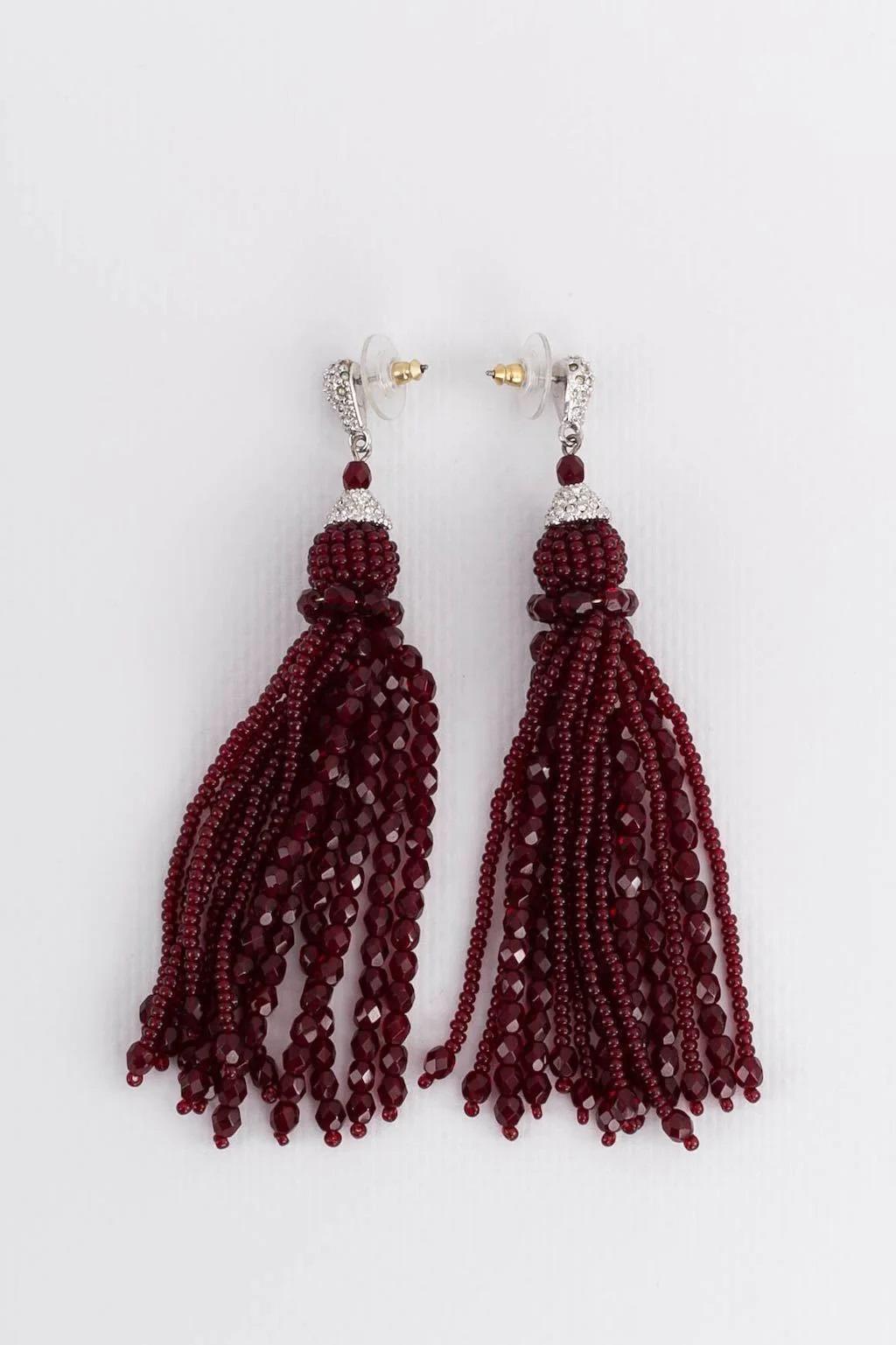 Christian Dior (Attributed to) Silver metal earrings set with rhinestones and beaded tassels. Not signed.

Additional information:
Dimensions: 10 L (3.94