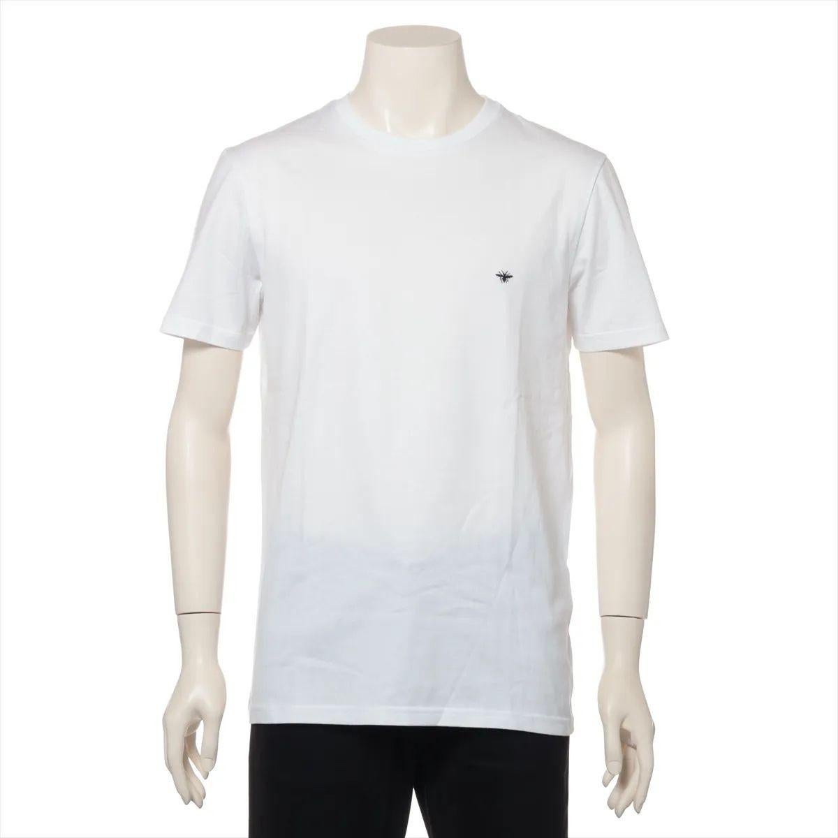The Dior Bee Embroidery Cotton T-shirt in White is a refined take on a casual wardrobe staple. Crafted from soft, high-quality cotton, the T-shirt features a classic crew neckline and a relaxed fit for effortless comfort. The standout detail is the