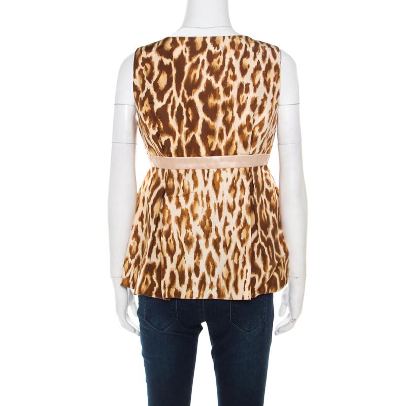 Dior offers yet another fabulous top for the ultra-glamorous woman in you. If you are looking for something classic and playful to wear then this piece is the perfect choice for you. Tailored from silk, this top has animal prints and a bow detail.

