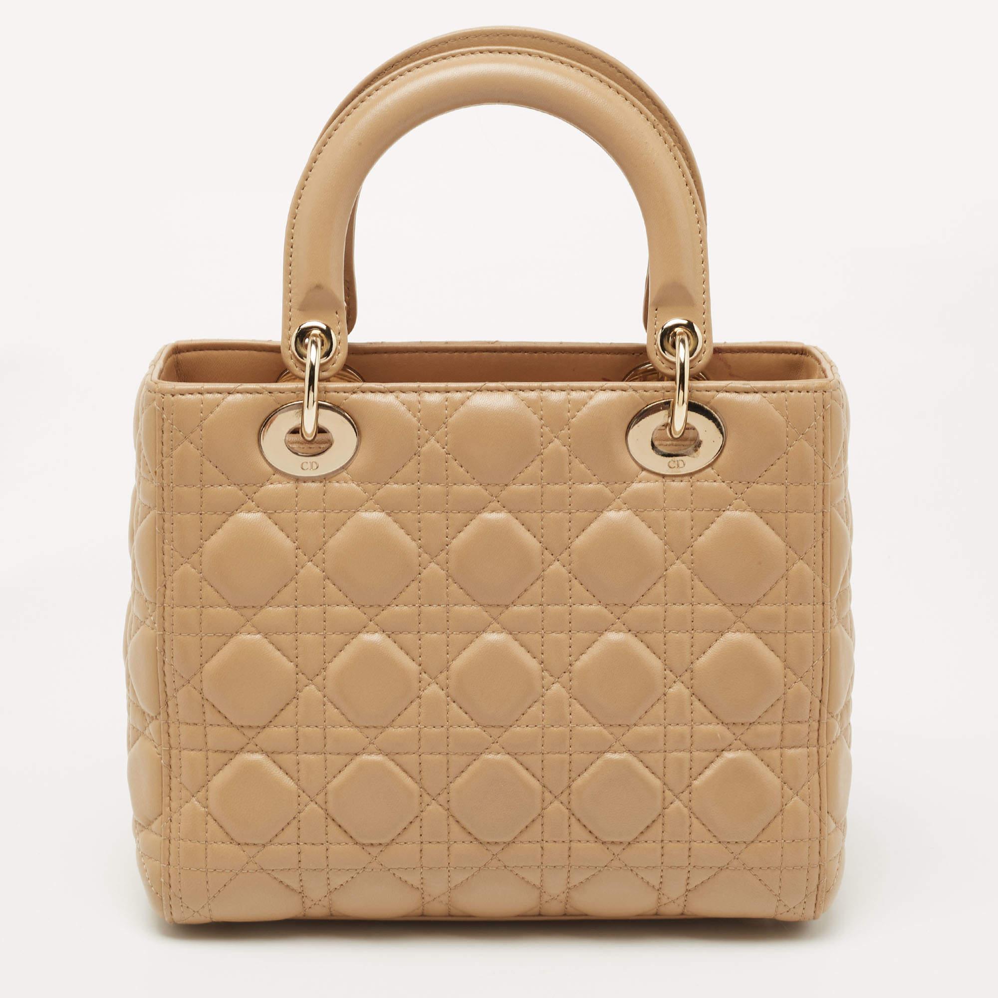 A timeless status and great design mark the Lady Dior tote. It is an iconic bag that people continue to invest in to this day. We have here this classic beauty crafted from beige Cannage leather. The bag has a lined interior for your essentials.