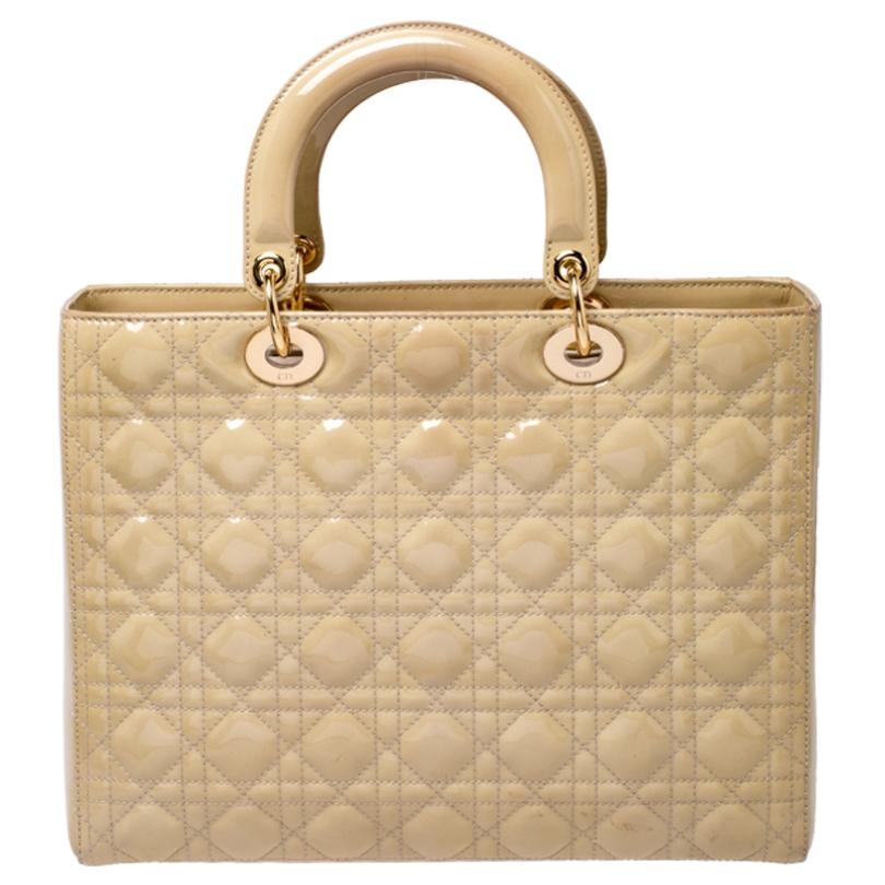 The Lady Dior tote is a Dior creation that has gained recognition worldwide and is today a coveted bag that every fashionista craves to possess. This beige tote has been crafted from patent leather and it carries the signature Cannage quilt. It is