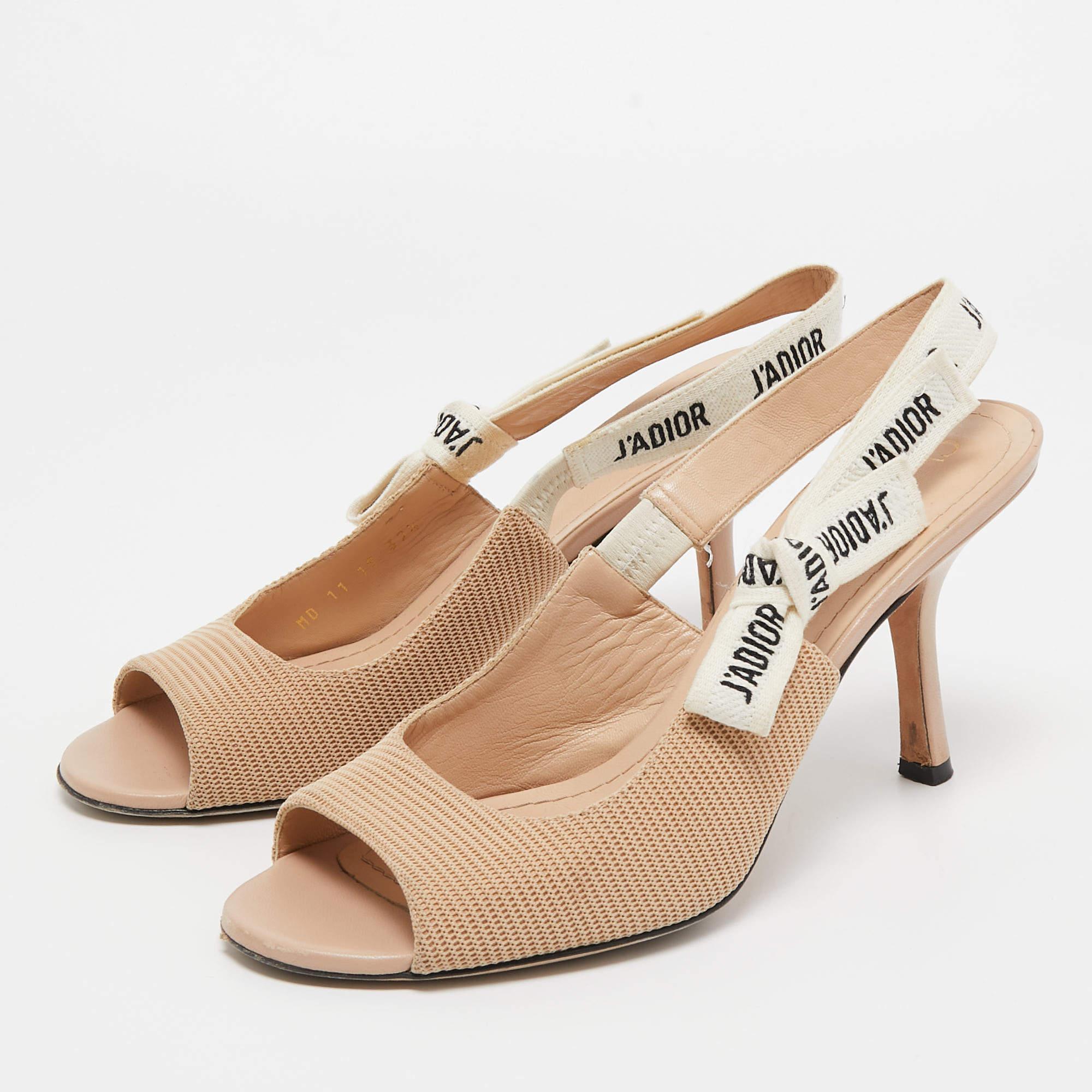 This pair of Dior pumps celebrates femininity like all other designs of the brand. Made from beige canvas the creation is highlighted with a 'J'adior' detailed slingback closure, and the sharp silhouette is balanced on 11cm heels.

