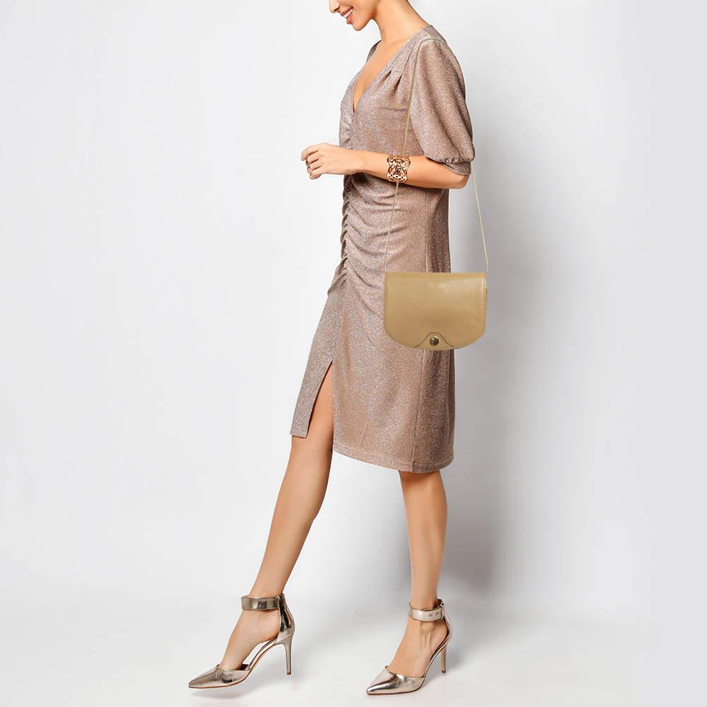 Structured sophisticated and stylish are some words that describe this crossbody bag Crafted from best quality material the creation is adorned with the labels signature appeal held by comfortable handles and equipped with a well spaced interior.