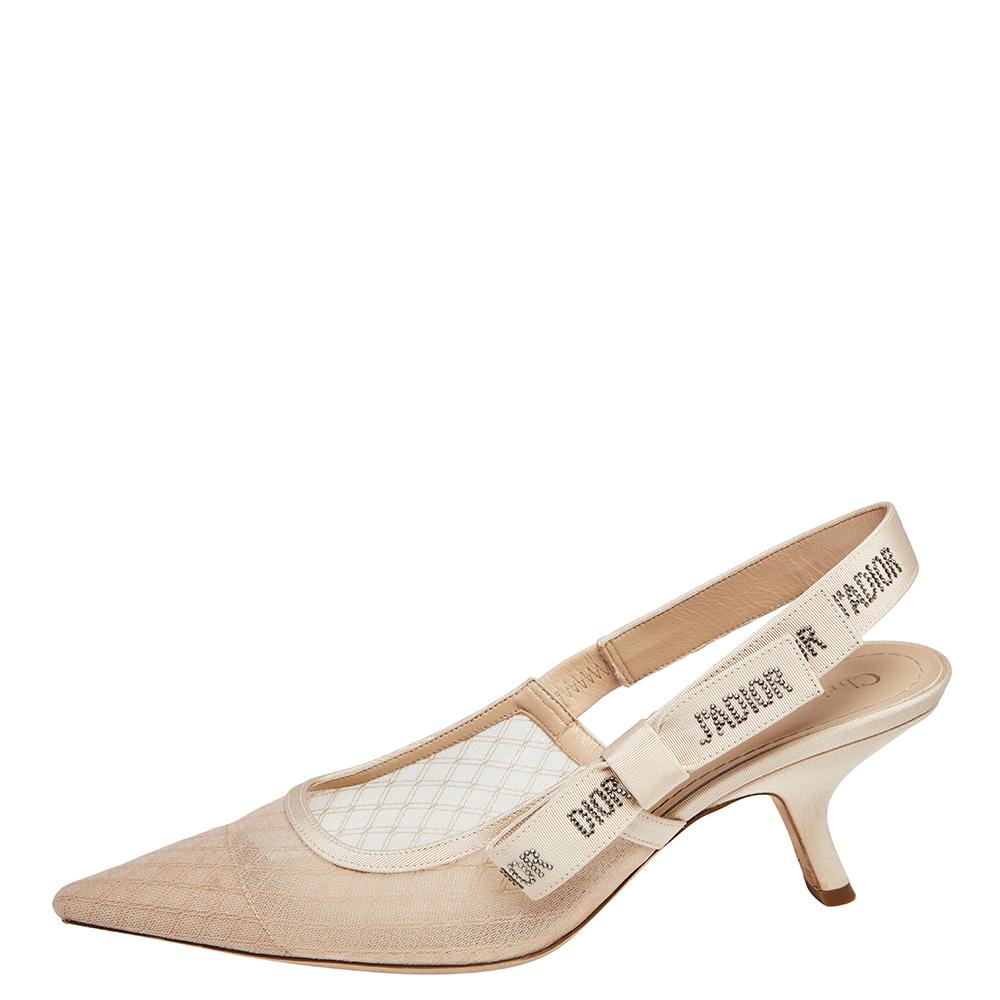 These popular J'Adior sandals exude an elegant and sophisticated aesthetic. Crafted from lace in a beige shade, the sandals have a sleek design with pointed toes. Adorned with slingbacks featuring the iconic 'J'Adior' wording, these exceptional