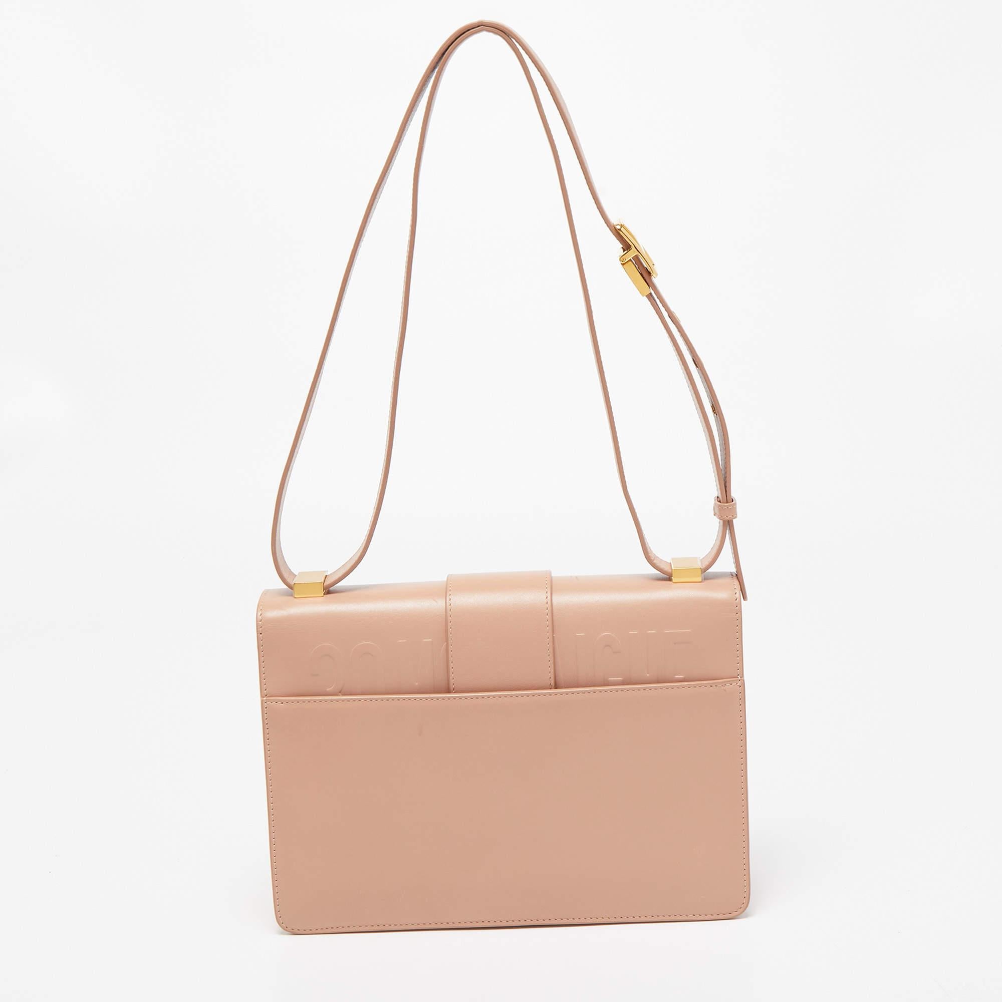 Inspired by the House's hallmark address, this Dior 30 Montaigne shoulder bag is the true embodiment of grace and luxury. The bag features a leather exterior and a gold-toned CD metal clasp on the front that derives its design from the seal of a