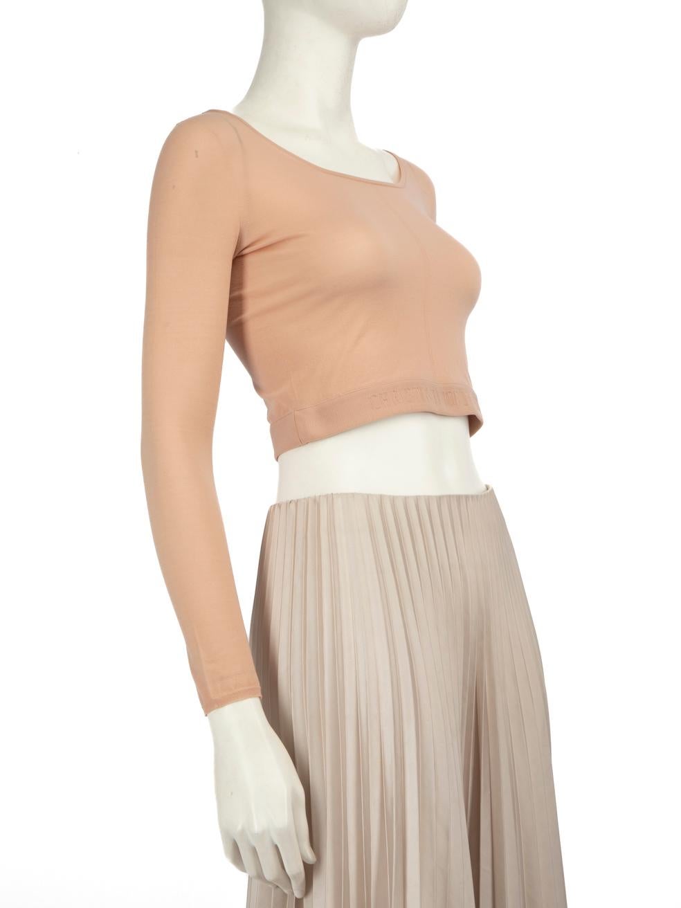 CONDITION is Very good. Minimal wear to top is evident. Minor pull to the weave on the left shoulder and loose brand tag on this used Dior designer resale item.
 
 Details
 Beige
 Synthetic
 Top
 Stretchy
 Long sleeves
 Embroidered hem
 Round neck
