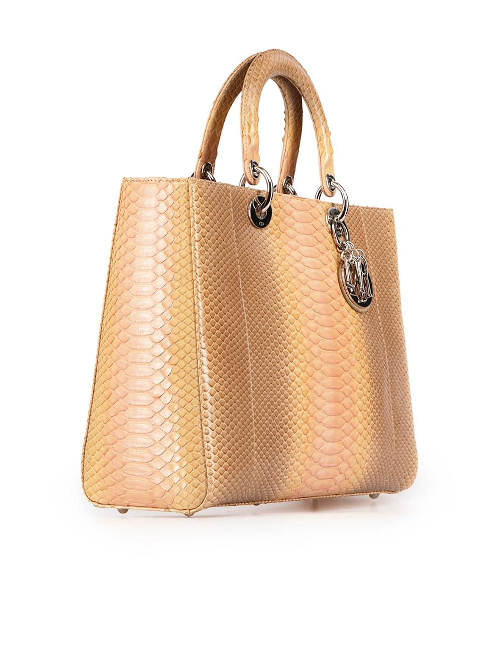 CONDITION is Very good. Minimal wear to bag is evident. Minimal wear to the texture of the snakeskin with very light peeling of the grain on this used Dior designer resale item. This bag comes with original dust bag.
 
 Details
 Lady Dior Tote
