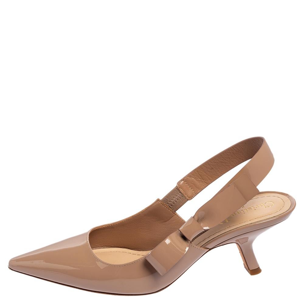 Simply luxe, these pumps from Dior will help you stay comfortable throughout the day! The beige sandals are crafted from patent leather and designed with pointed toes and slingbacks. They flaunt bow details on the sides and come equipped with