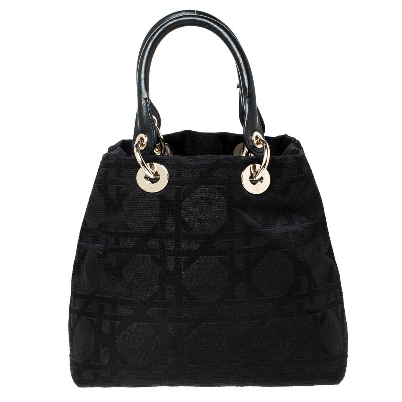 The Lady Dior tote is a Dior creation that has gained recognition worldwide and is today a coveted bag that every fashionista craves to possess. This black tote has been crafted from canvas and it carries the signature Cannage quilt. It is equipped