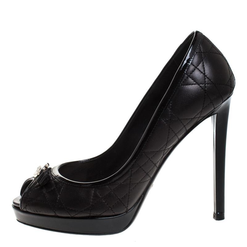 Nothing like an adorable pair of pumps to look and feel like a modern princess! Crafted from leather in a black hue, this gorgeous Dior pair features the signature Cannage pattern all over. Complete with stiletto heels and bow on the peep-toe vamps,
