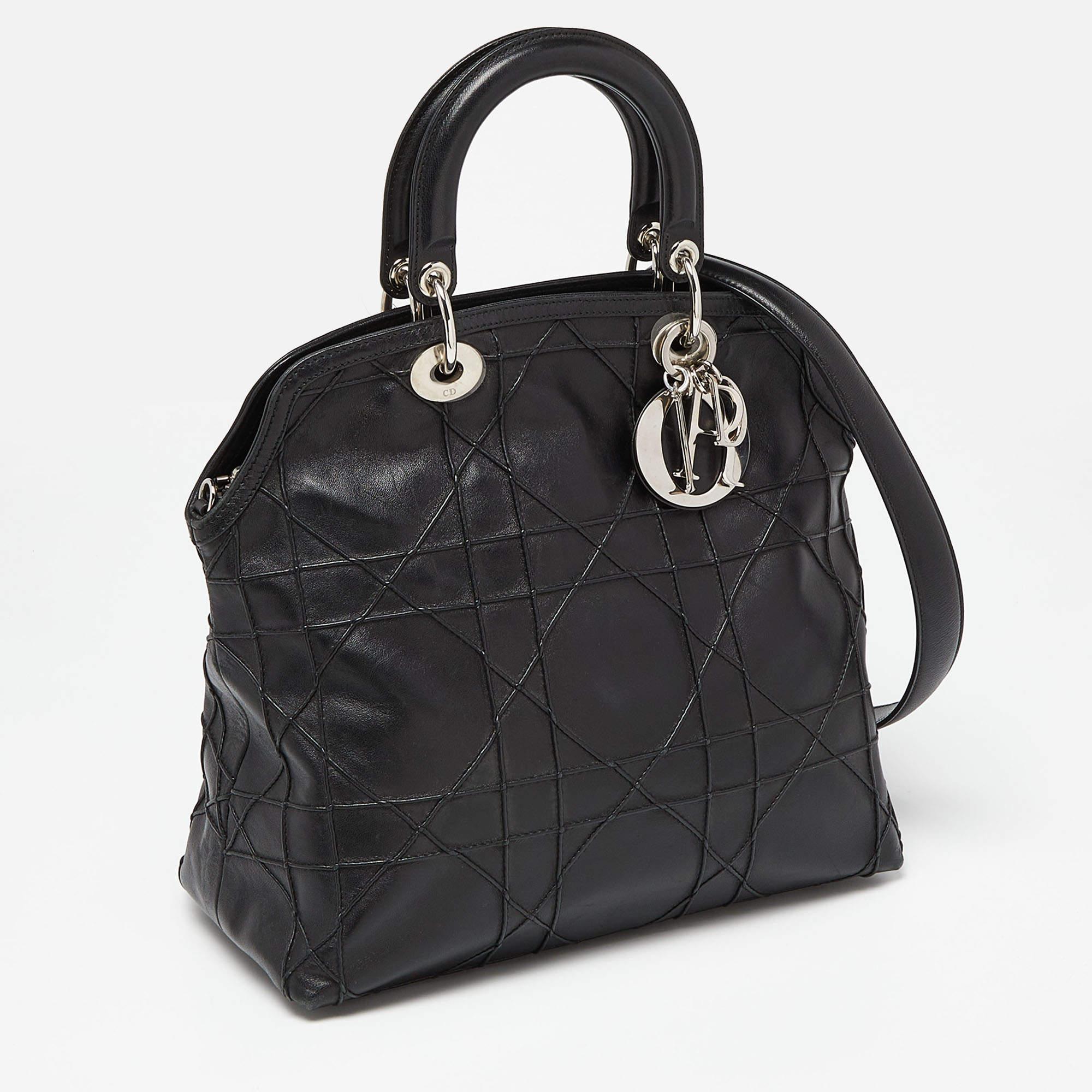 Perfect for work or travel, this Dior Granville tote is made of Cannage leather to be classy and durable. It has dual top handles, a shoulder strap, and a spacious lined interior.

