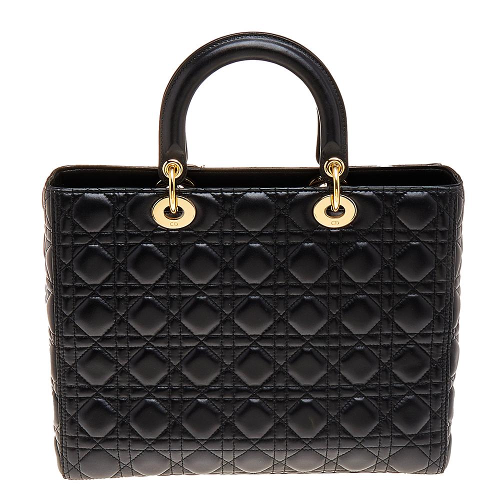 The Lady Dior tote is a Dior creation that has gained recognition worldwide and is today a coveted bag that every fashionista craves to possess. This black tote has been crafted from leather and it carries the signature Cannage quilt. It is equipped
