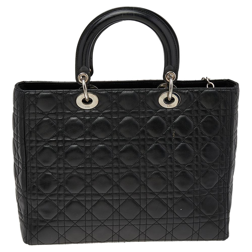 The Lady Dior tote is a Dior creation that has gained recognition worldwide and is today a coveted bag that every fashionista craves to possess. This black tote has been crafted from leather and it carries the signature Cannage quilt. It is equipped