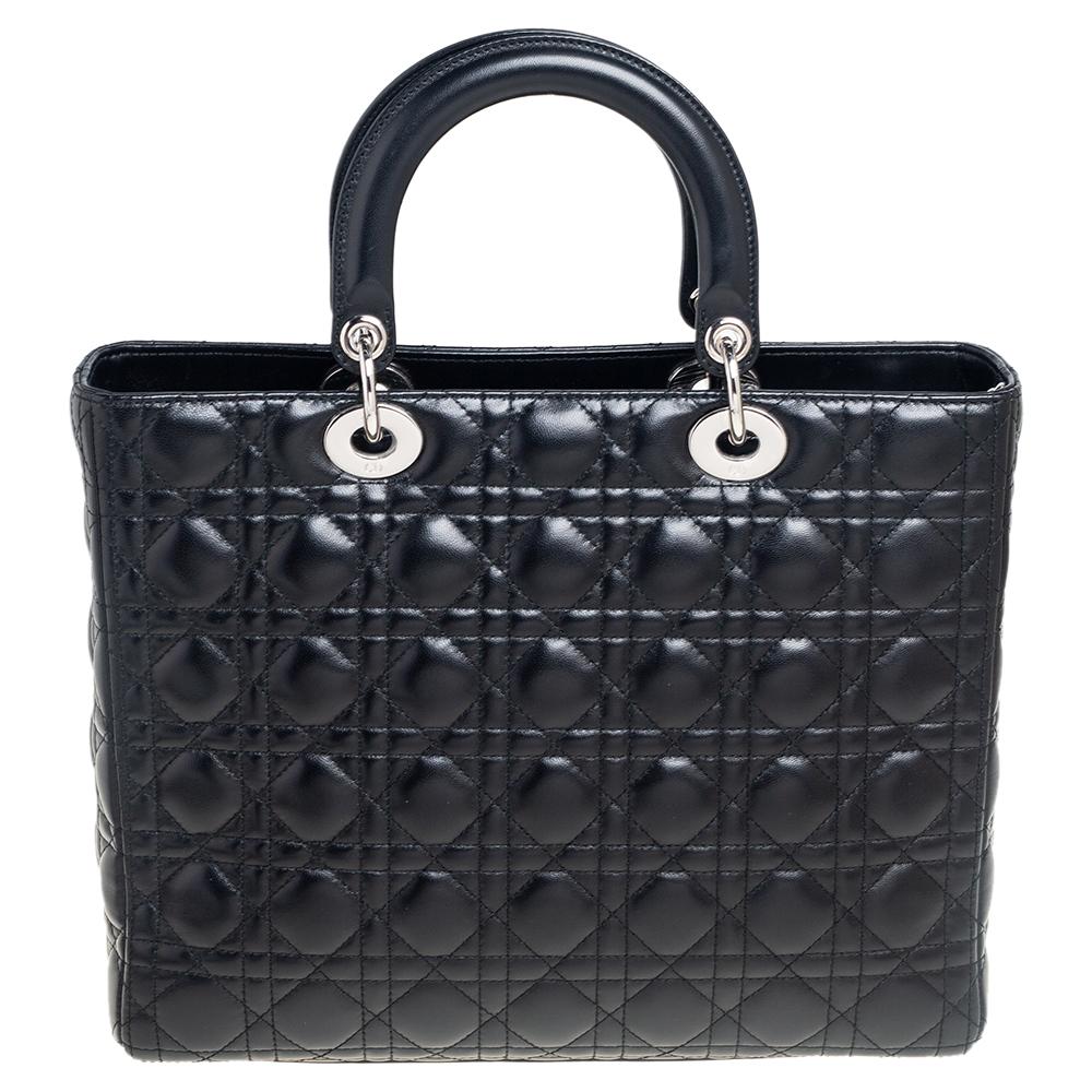 A timeless status and great design mark the Lady Dior tote. It is an iconic bag that people continue to invest in to this day. We have here this classic beauty crafted from Cannage leather. The bag has a lined interior for your essentials. This