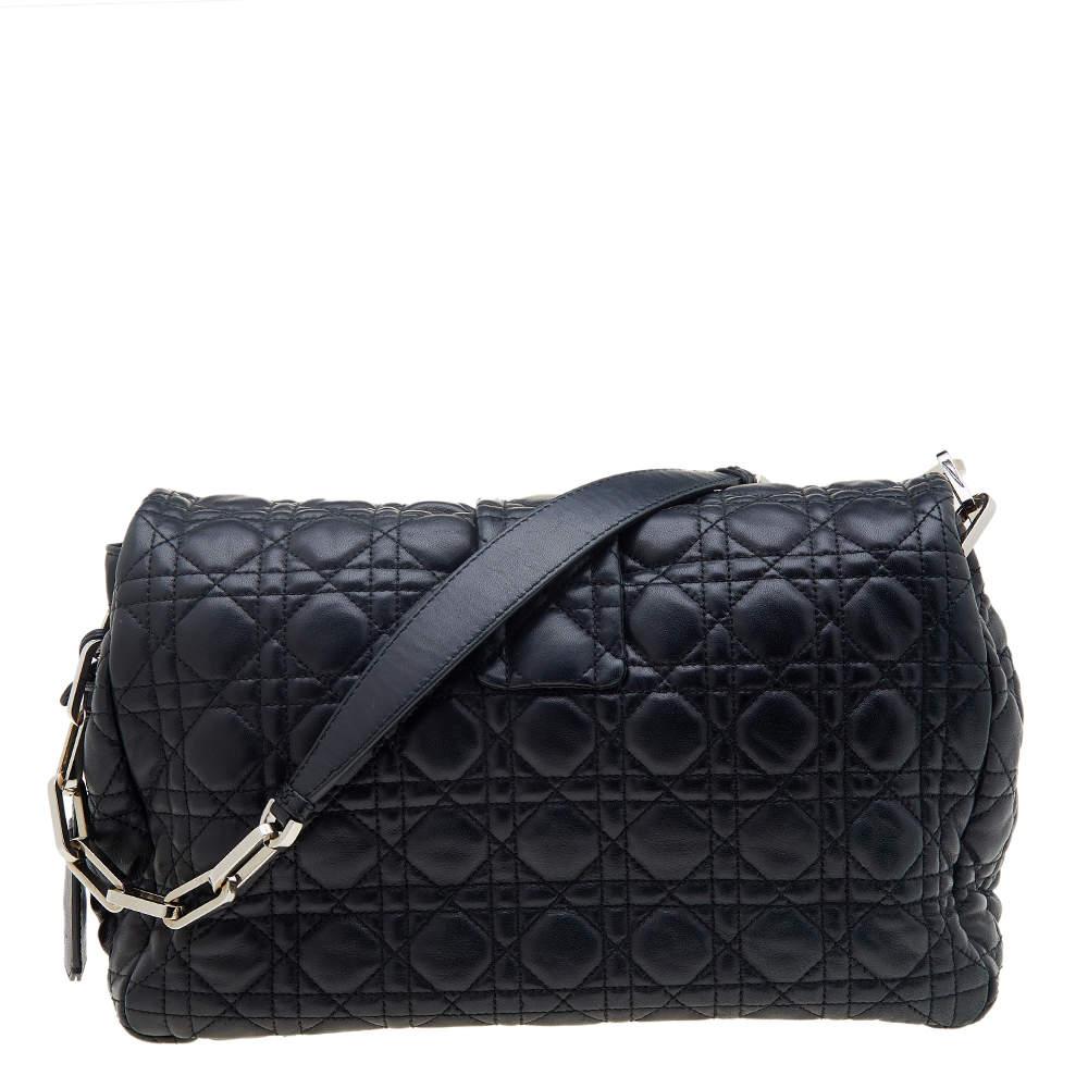 Flap bags like this Miss Dior hold the promise of enduring style, to be part of your forever collection. Crafted from leather, this Dior bag features a black Cannage quilted exterior and a chain-link strap. The front flap has a silver-tone push lock
