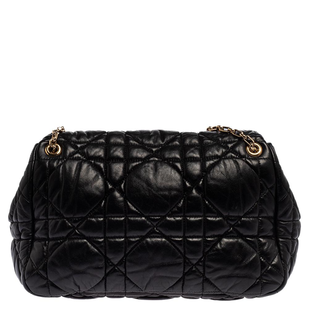 Looking for a chic and elegant bag with a vintage flair? This Christian Dior Milly La Forêt flap bag is the one for you. This classic flap style bag is made of quilted leather with cannage pattern and a chain-link strap with a leather shoulder