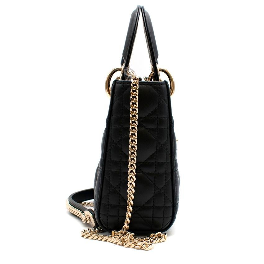 Dior Mini Dior lady bag in black with gold hardware

- quilted body - hand strap and removable shoulder strap with gold chain - Dior gold charm - holds shape well - flap closure - red lining - one zipper card holder pocket

Please note, these items