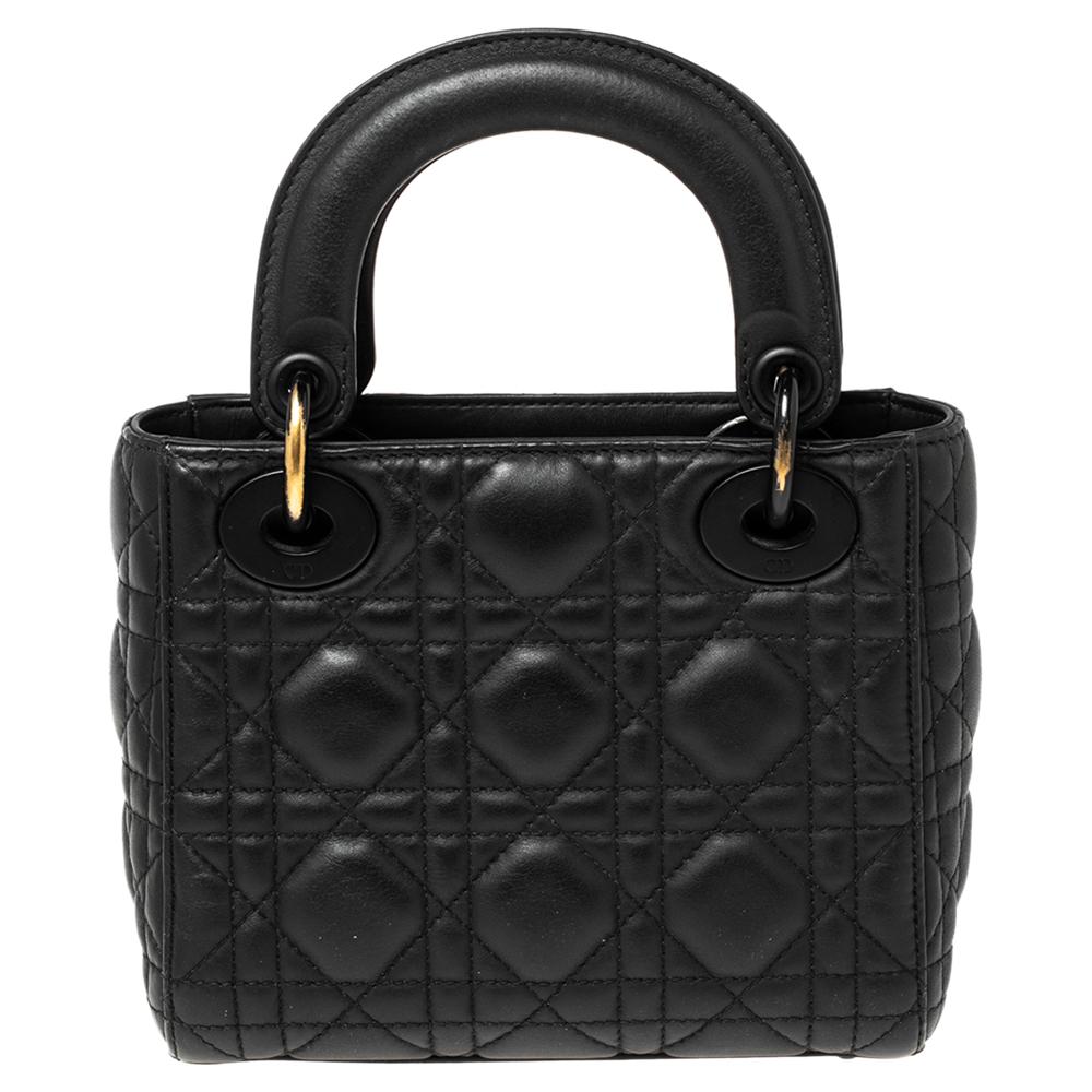The Lady Dior tote is a Dior creation that has gained recognition worldwide and is today a coveted bag that every fashionista craves to possess. This black tote has been crafted from leather and it carries the signature Cannage quilt. It is equipped