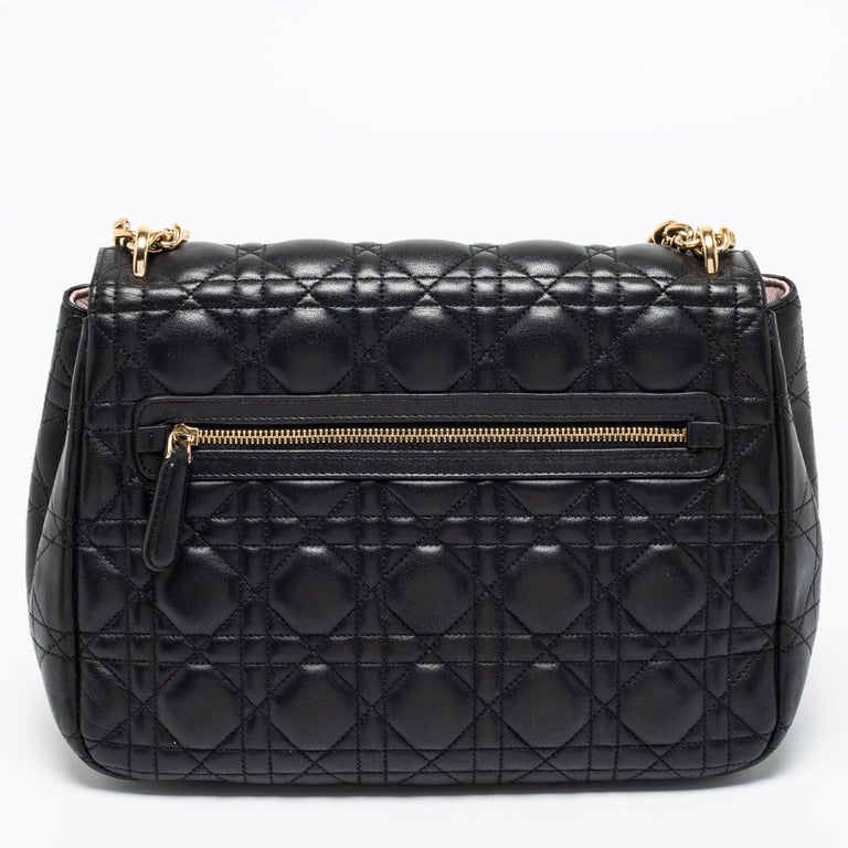 Flap bags like this Miss Dior hold the promise of enduring style to be part of your forever collection. Crafted from leather, this Dior bag features a black Cannage quilted exterior and a chain-link strap. The front flap has a gold-tone lock that
