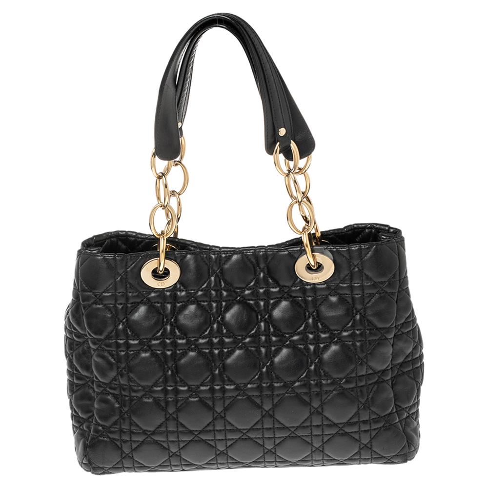 The Lady Dior tote is a Dior creation that has gained recognition worldwide and is today a coveted bag that every fashionista craves to possess. This black tote has been crafted from soft leather and it carries the signature Cannage quilt. It is