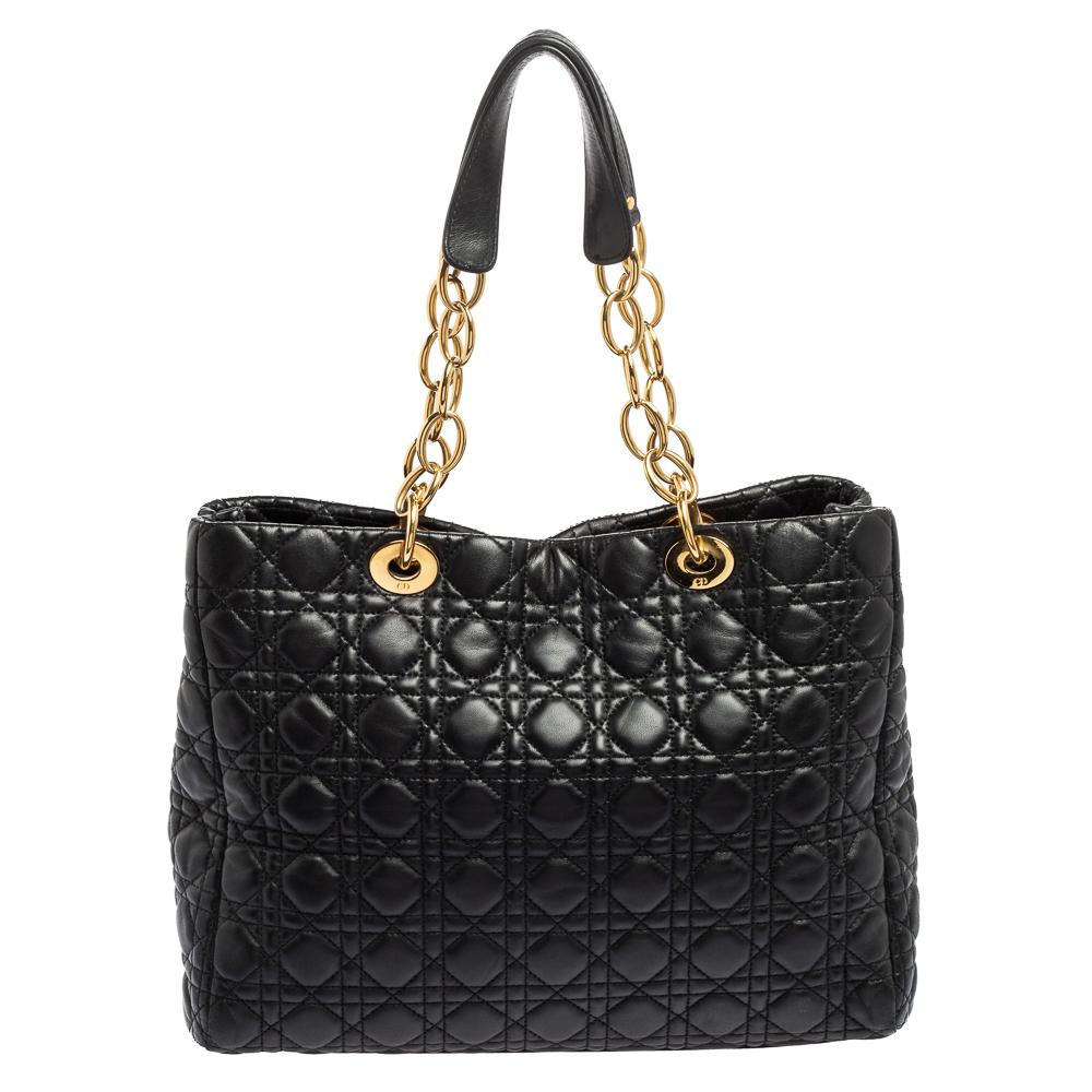The shopper tote to buy today is this one by Dior! Crafted with expertise, the Lady Dior tote has the signature Cannage pattern on leather, two chain-leather handles on top, a spacious fabric interior, and brand letter charms.

Includes: