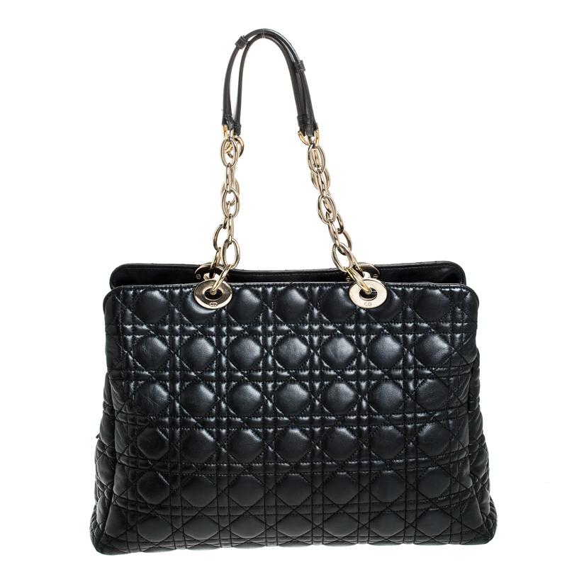 The Lady Dior tote is a Dior creation that has gained recognition worldwide and is today a coveted bag that every fashionista craves to possess. This black tote has been crafted from leather and it carries the signature Cannage quilt. It is equipped