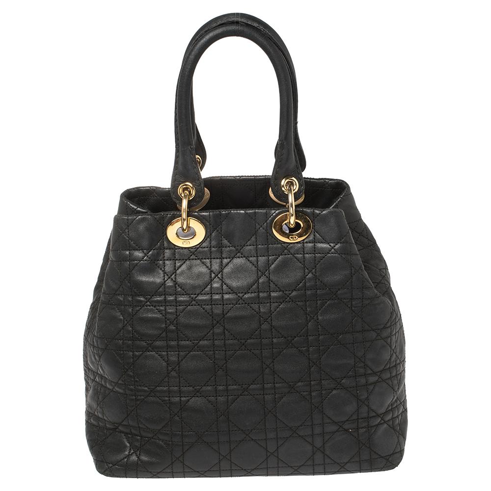 The Lady Dior tote is a Dior creation that has gained recognition worldwide and is today a coveted bag that every fashionista craves to possess. This black tote has been crafted from soft leather and it carries the signature Cannage quilt. It is