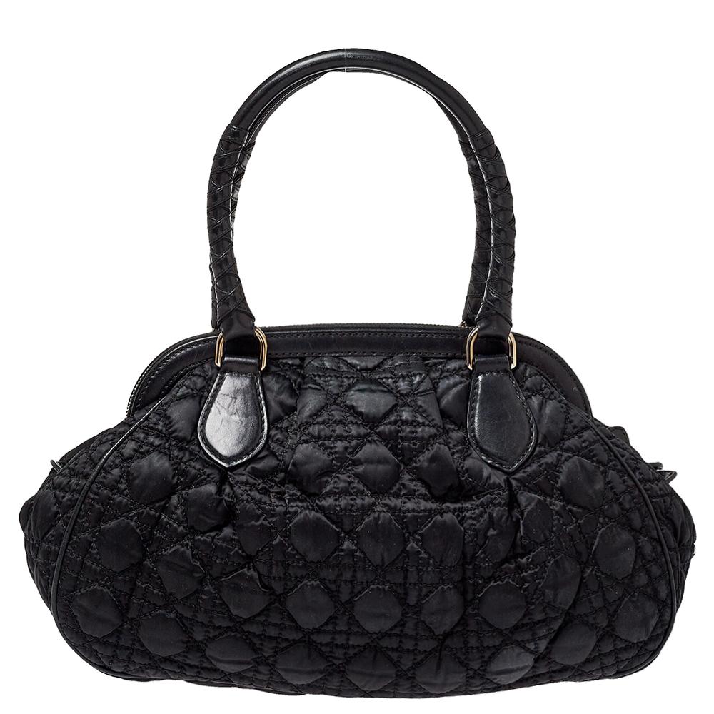 Dior’s take on the classic doctor bag, this vintage-inspired nylon, and leather creation has a capacious interior to hold your daily accompaniments. It features the signature Cannage quilted pattern on the exterior and is nicely finished with dual