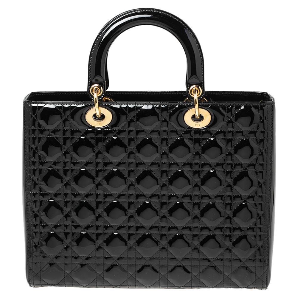 The Lady Dior tote is a Dior creation that has gained recognition worldwide and is today a coveted bag that every fashionista craves to possess. This black tote has been crafted from patent leather and it carries the signature Cannage quilt. It is